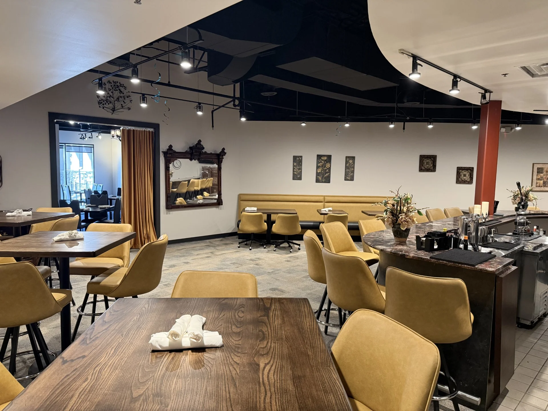 Modern restaurant interior with stylish seating and bar area