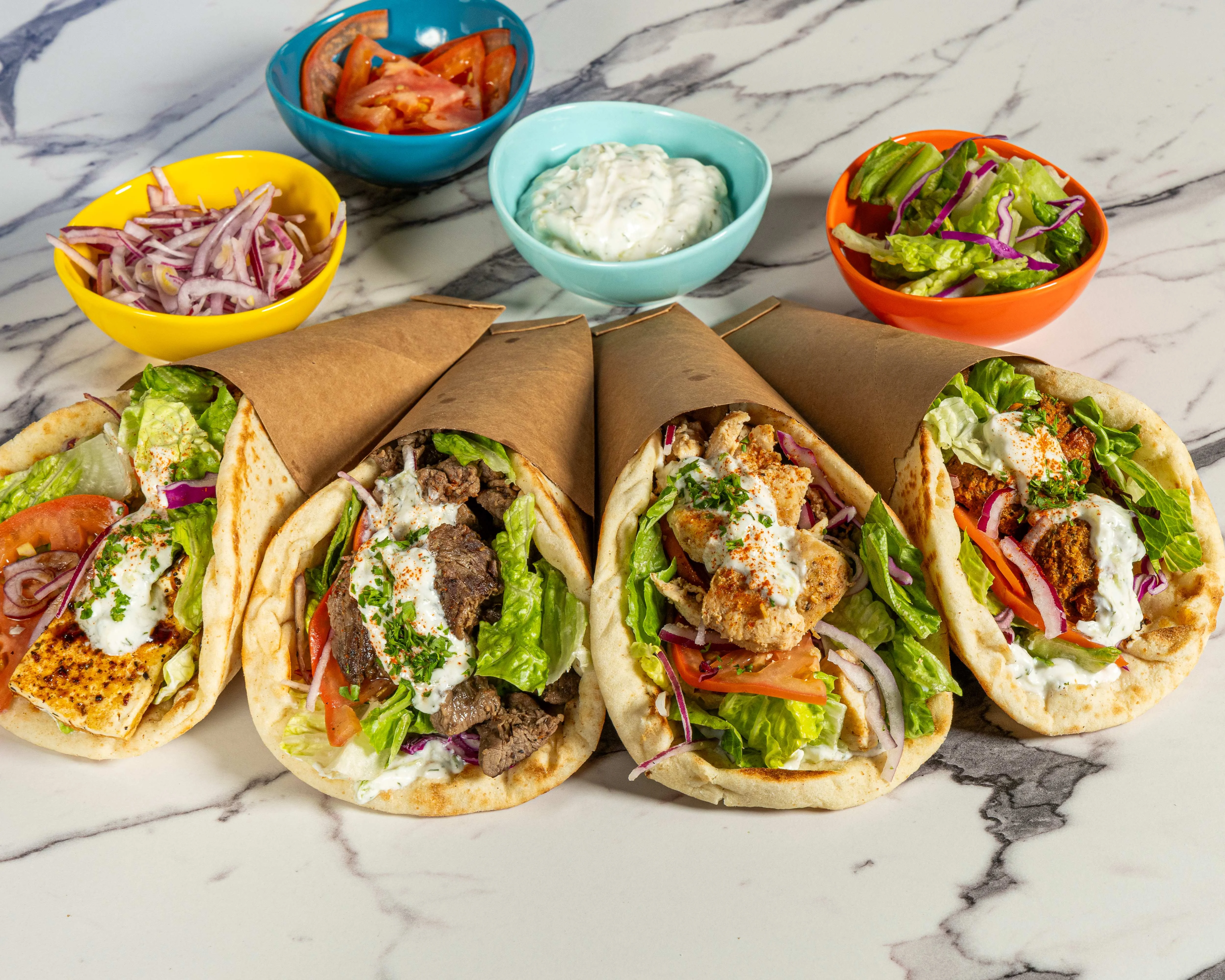 Mediterranean gyros wrapped in pita with fresh vegetables