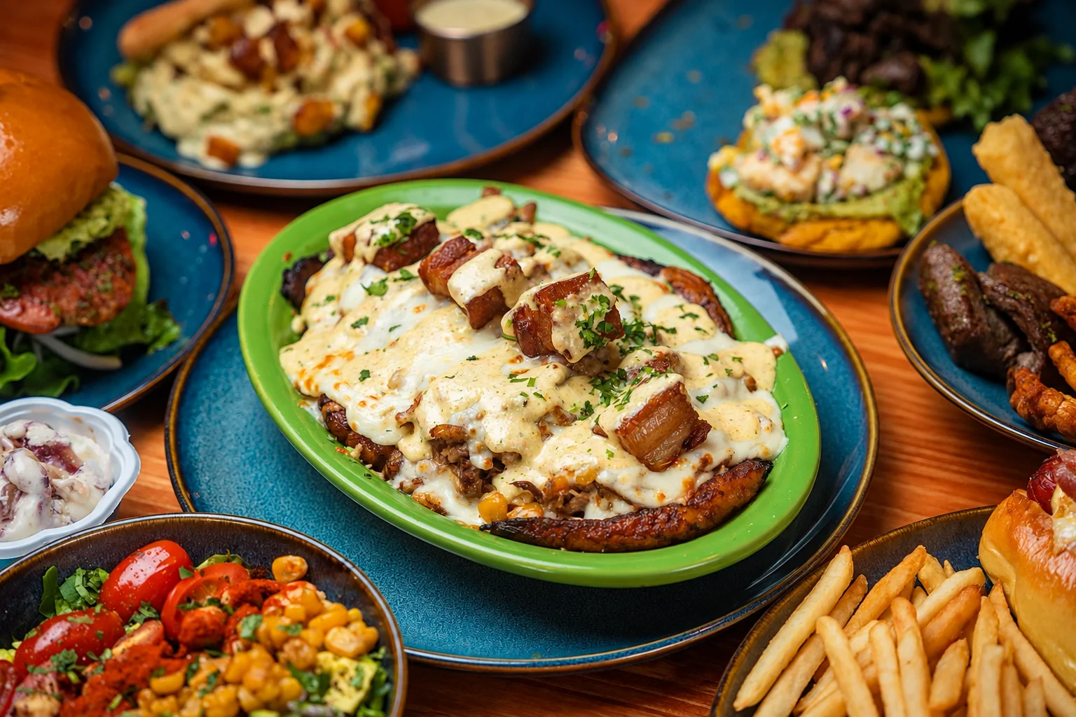 Savory Mexican nachos topped with cheese and pork belly