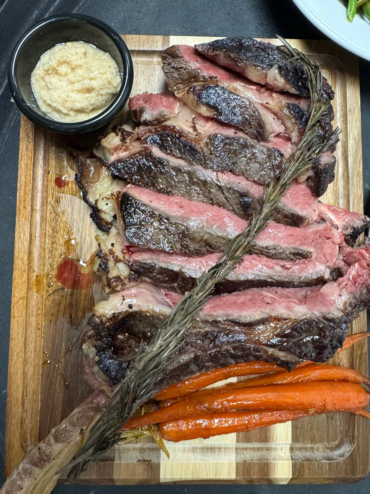 Grilled ribeye steak served with horseradish sauce