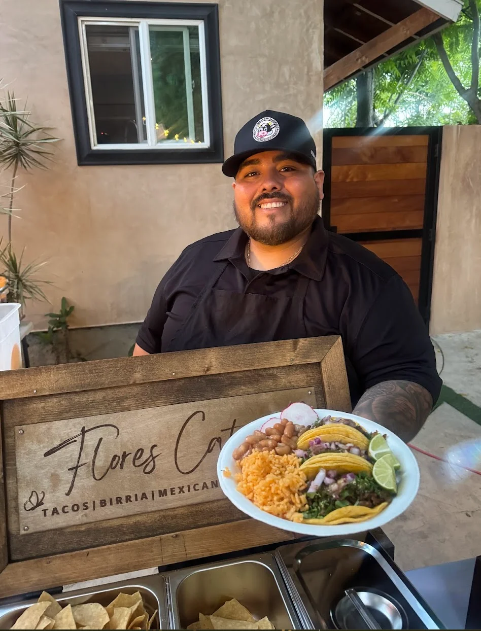 Plate of Mexican birria tacos with rice and beans