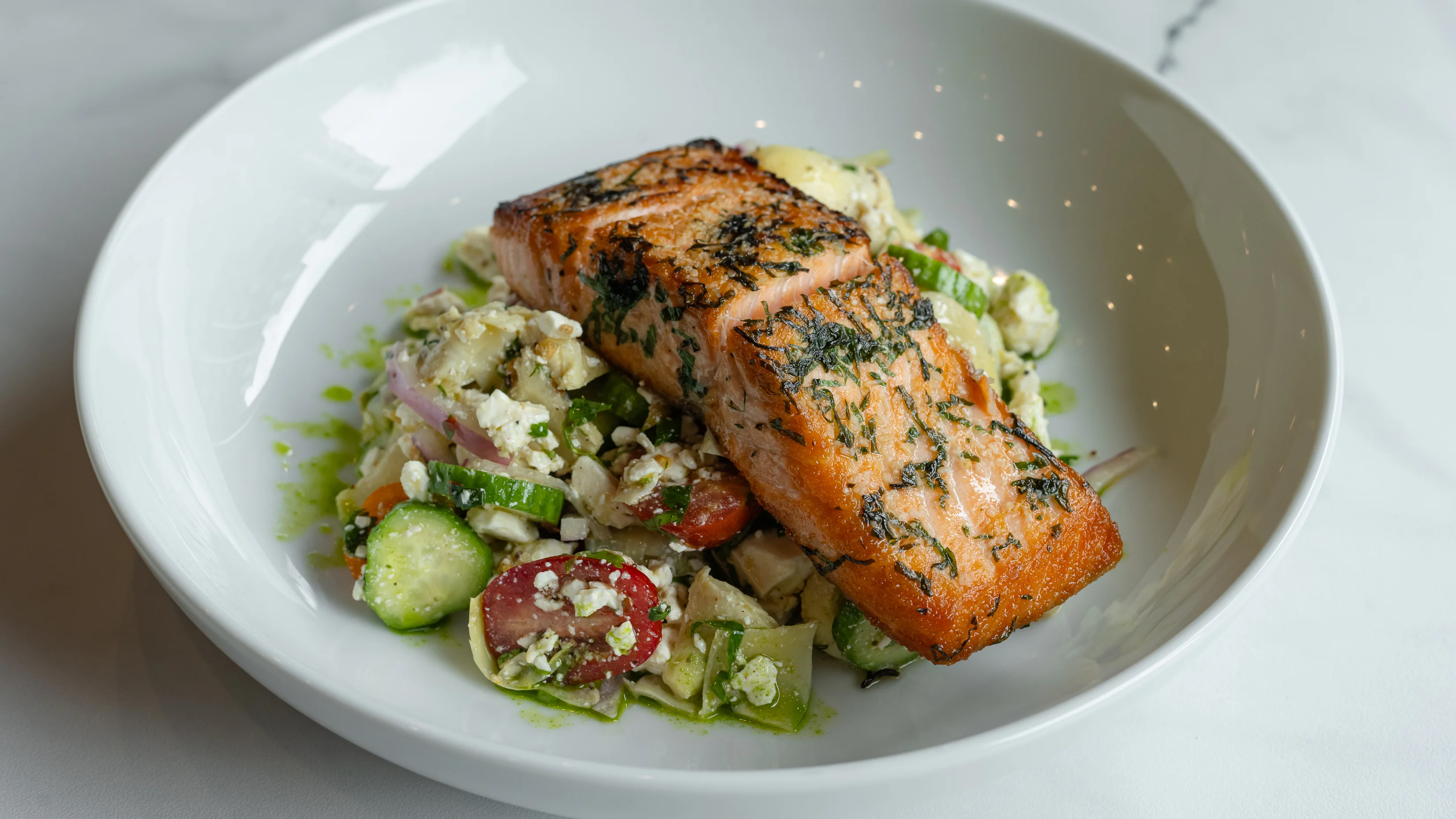 Grilled salmon with Mediterranean salad