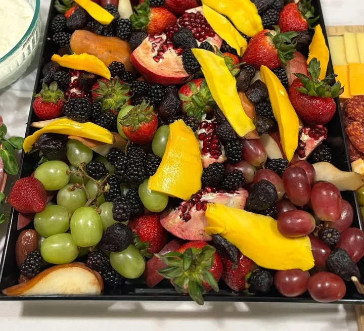 Colorful fruit platter with assorted berries and tropical fruits