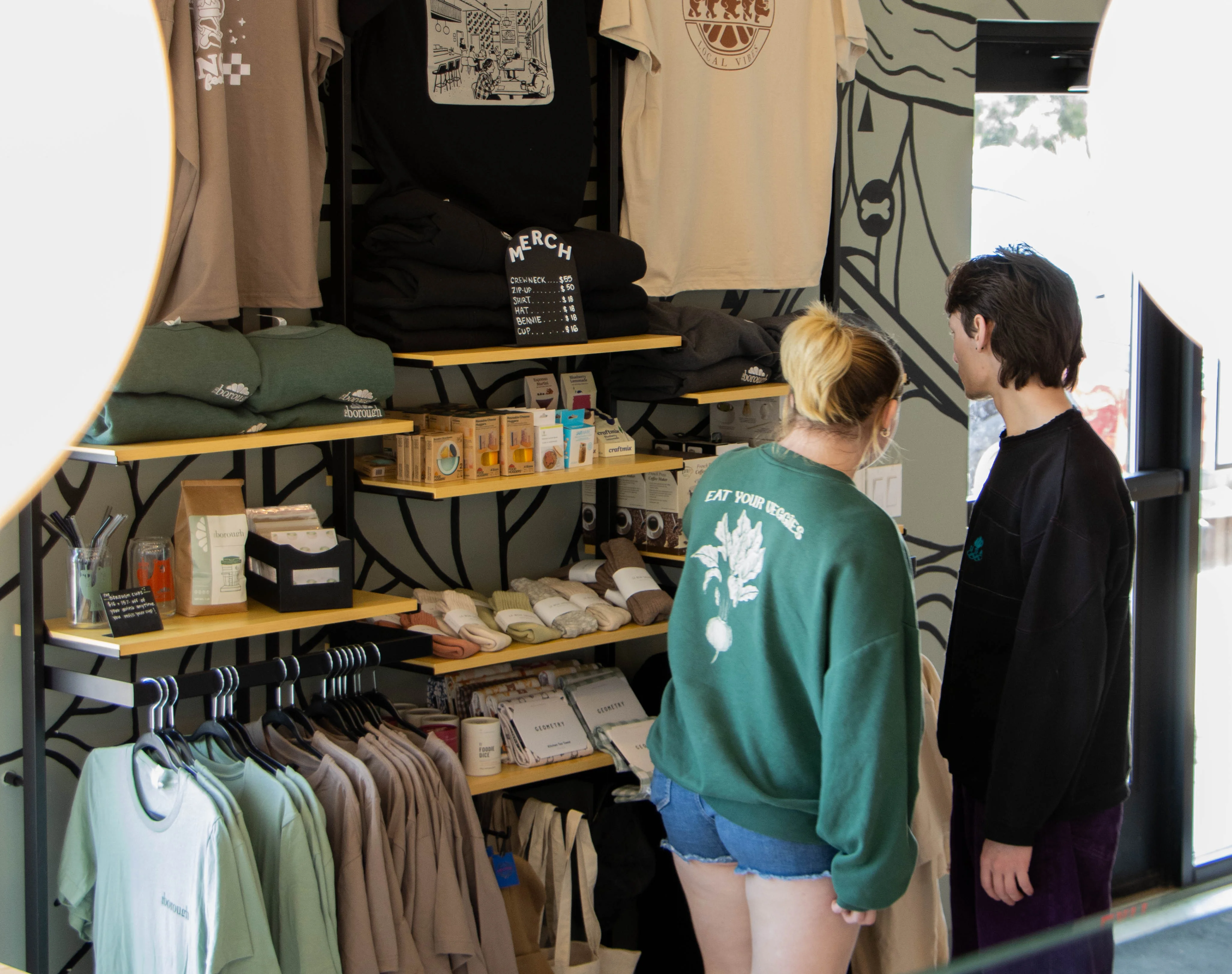 Two People browsing shelves of merchandise 