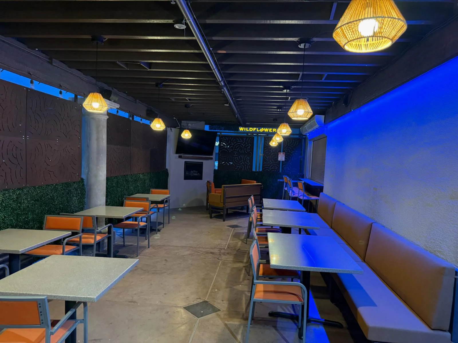 Cozy restaurant patio with modern decor and ambient lighting
