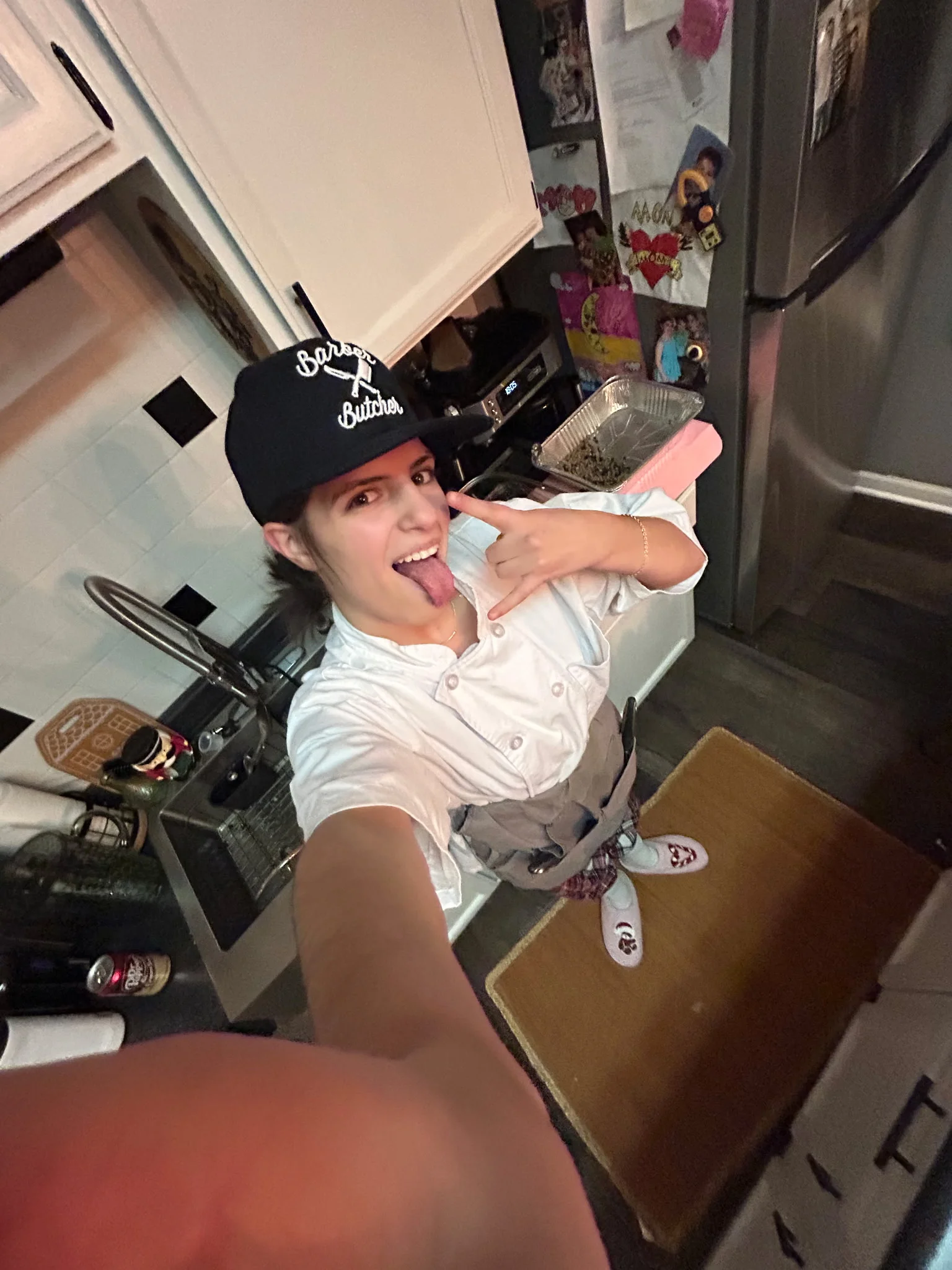 Chef posing playfully in a home kitchen