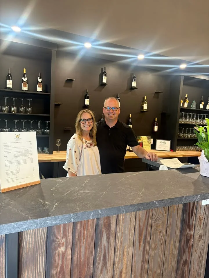 Welcoming restaurant owners at a modern bar counter