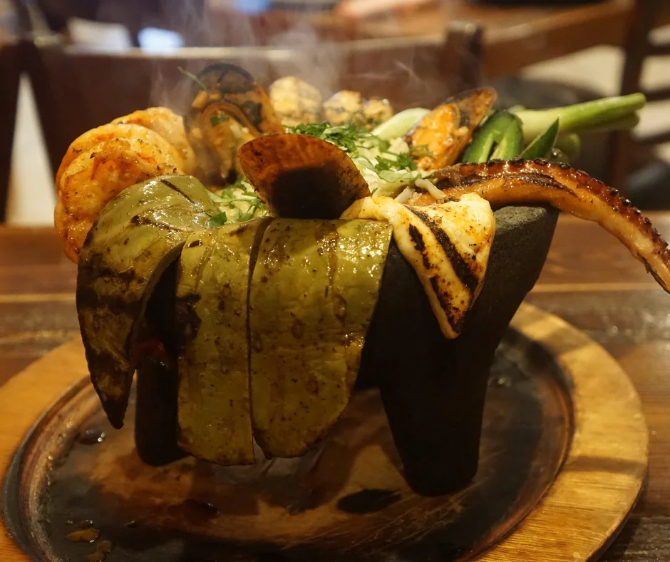 Delicious gourmet burger with fresh toppings on a wooden table