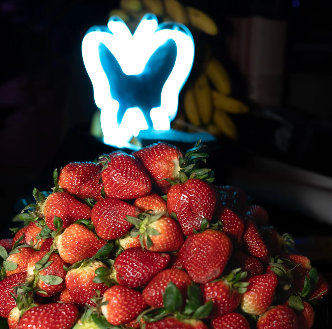Fresh strawberries piled high on a serving platter