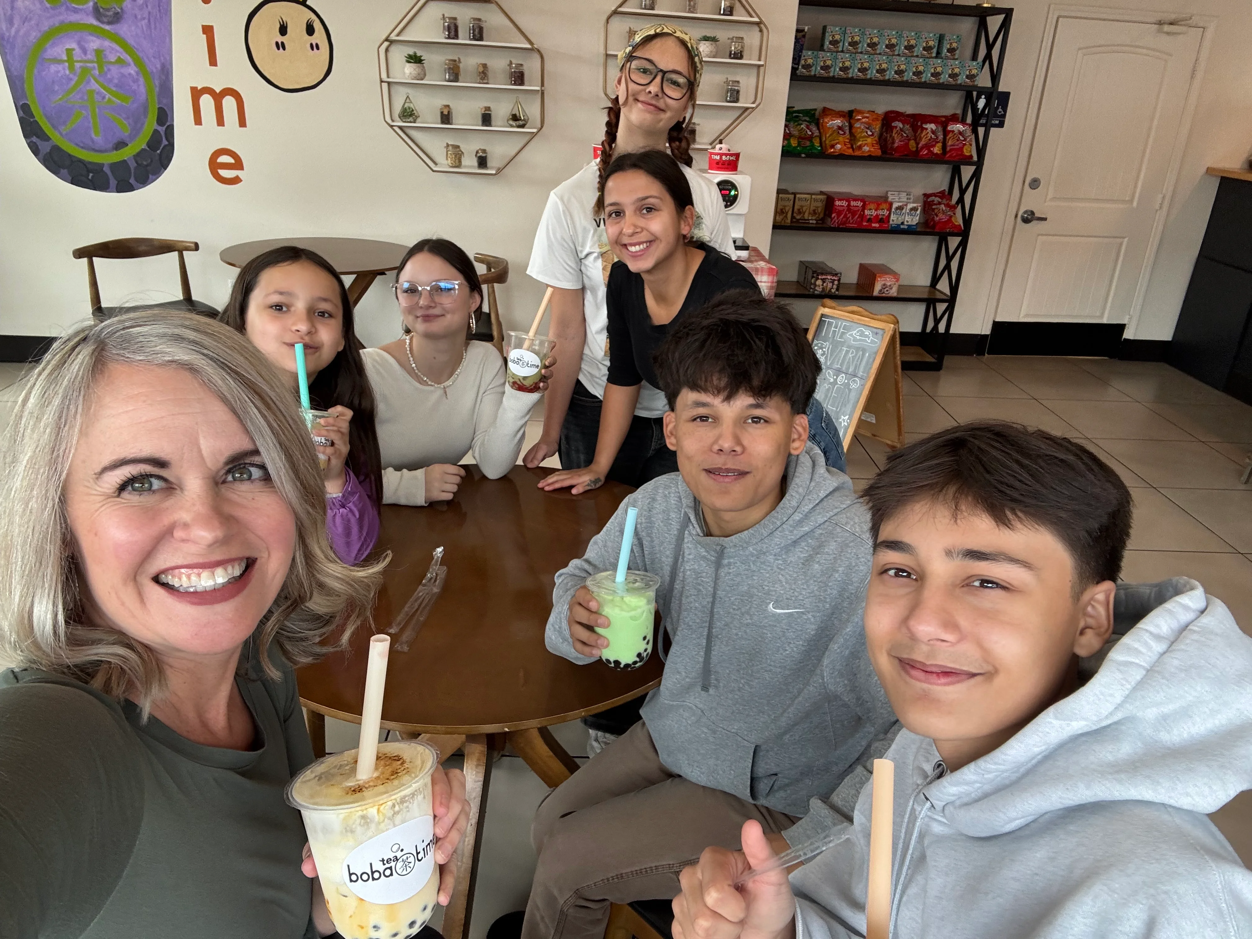 Group enjoying bubble tea at a cozy café