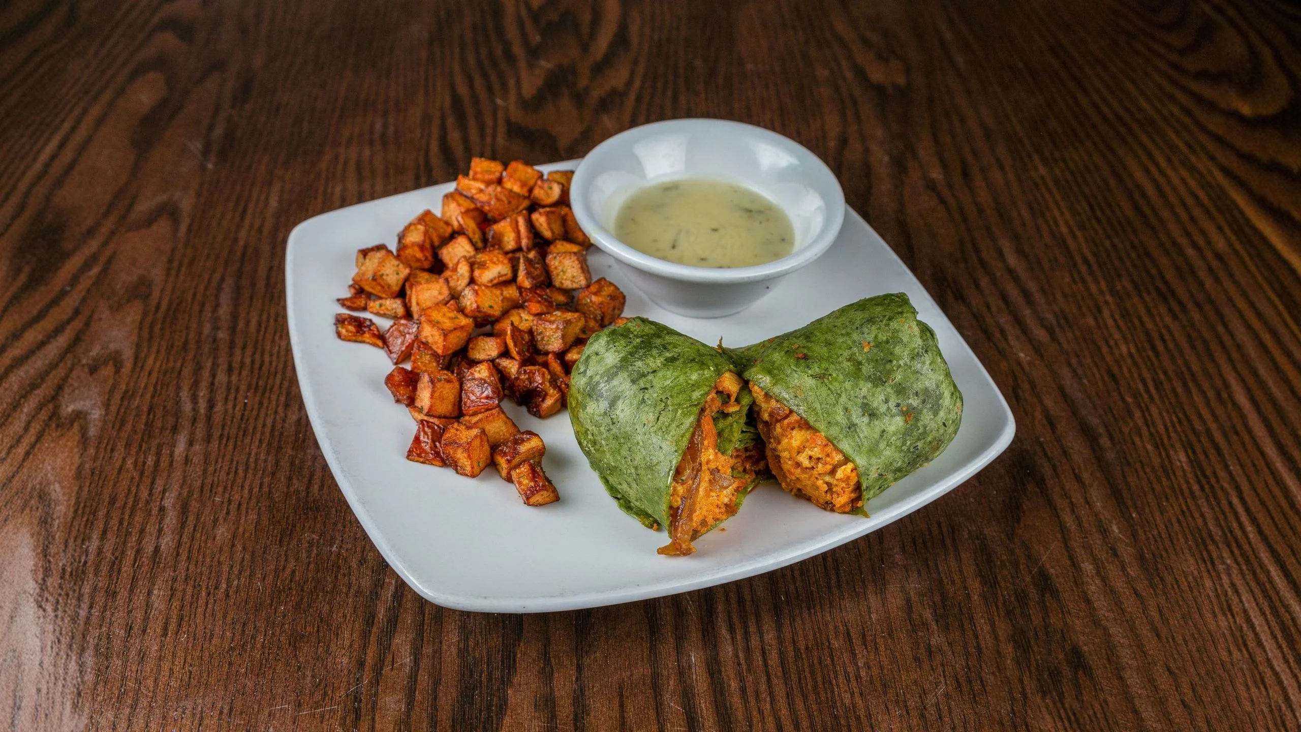 Spicy burrito with sweet potatoes and dipping sauce