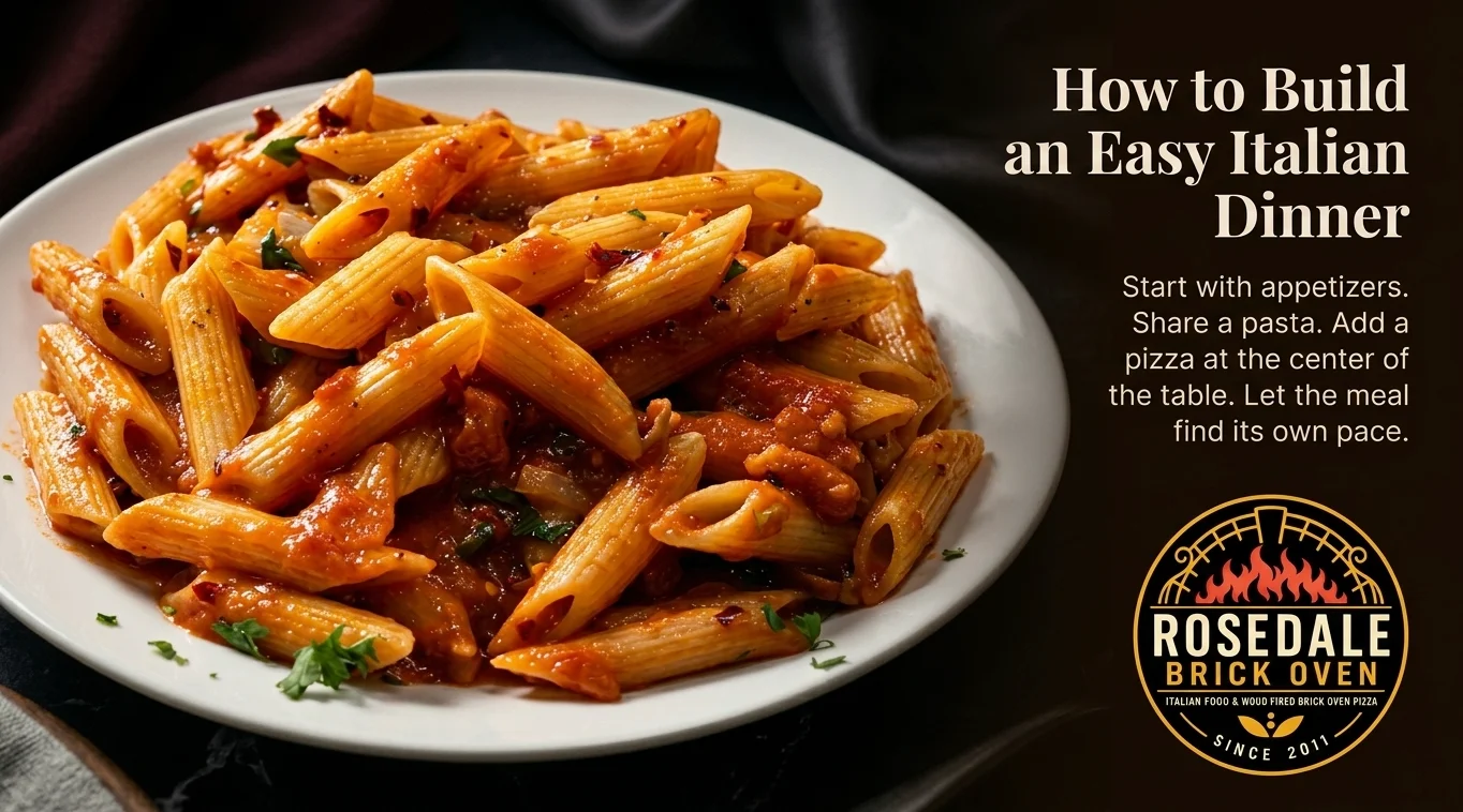Italian penne arrabbiata pasta on a plate beside restaurant dinner typography