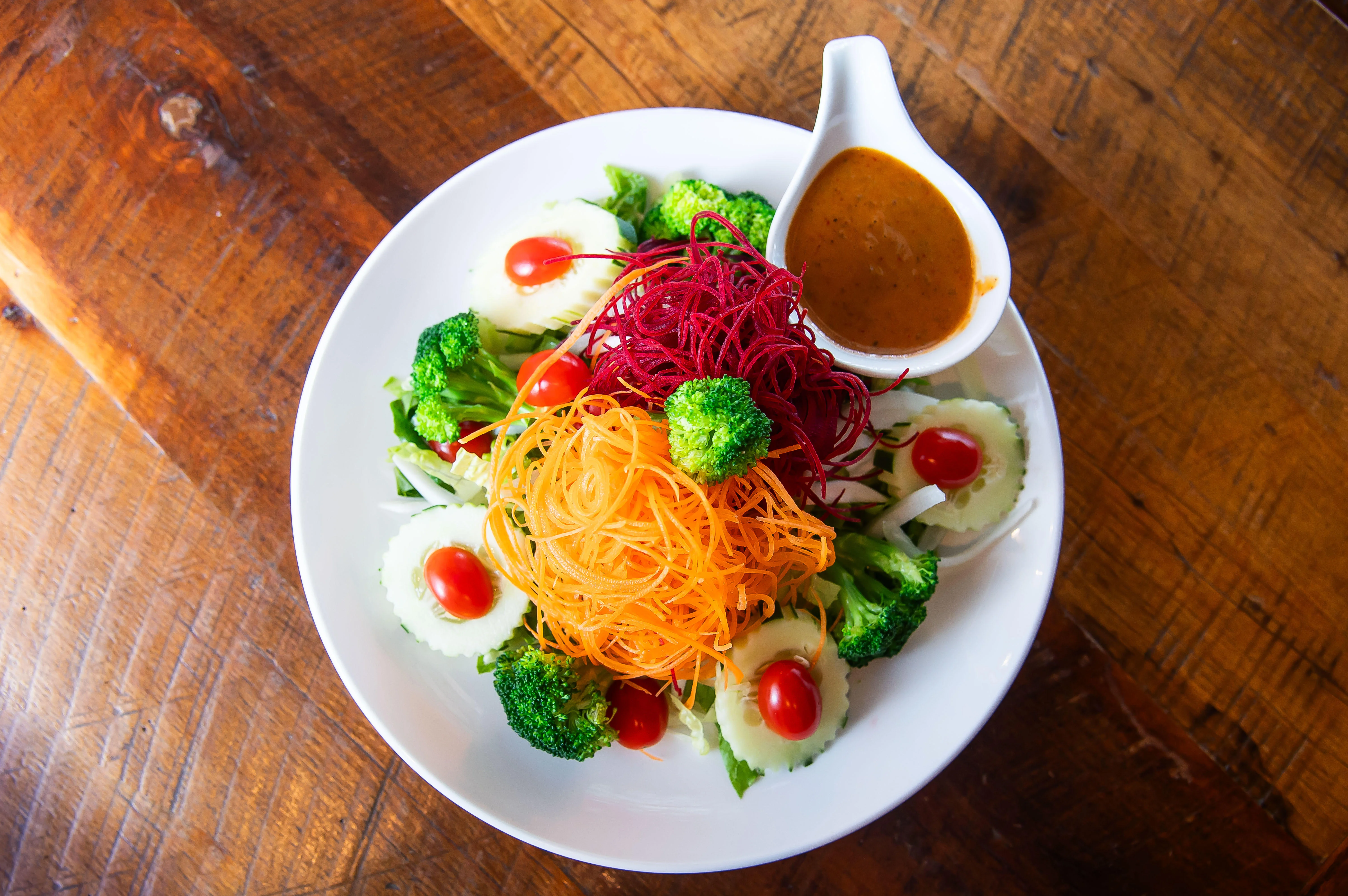 Colorful Asian-inspired salad with vibrant vegetables and dressing