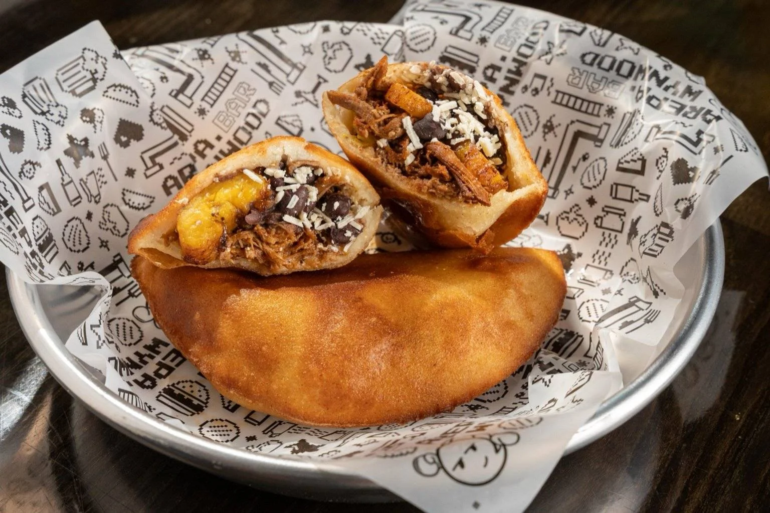 Crispy Colombian arepas filled with savory meats