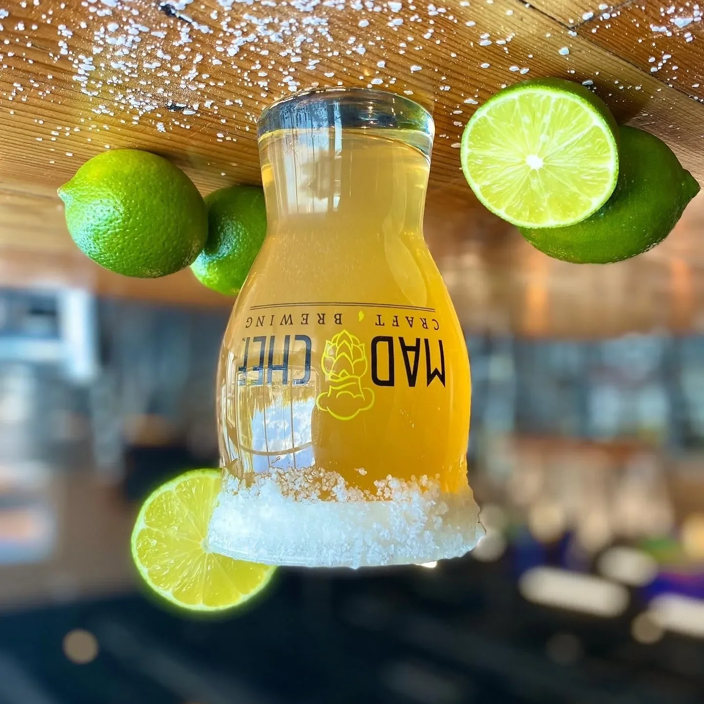 Craft beer with lime garnish in a brewery setting