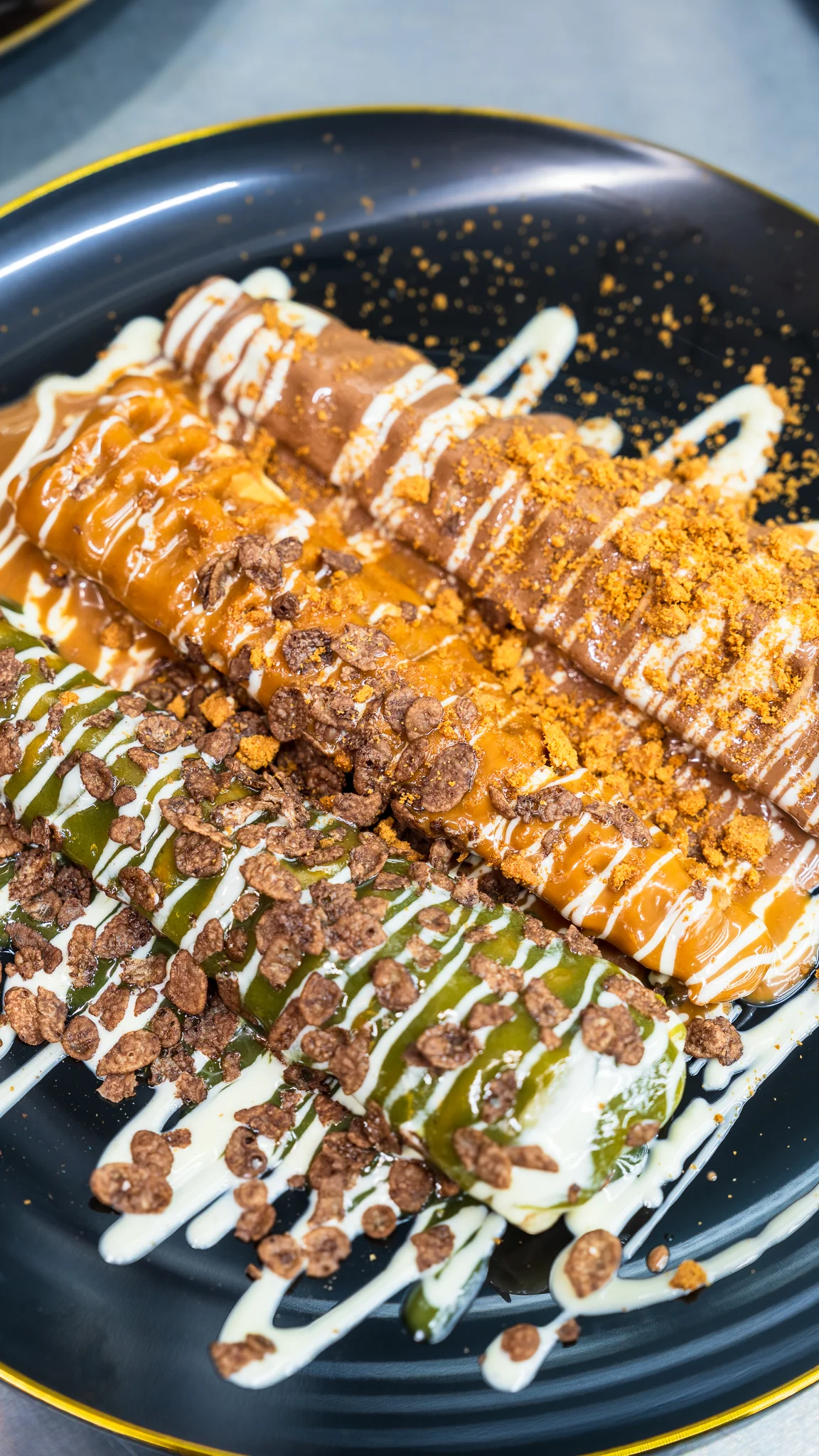 Delicious dessert crepes with chocolate and matcha toppings