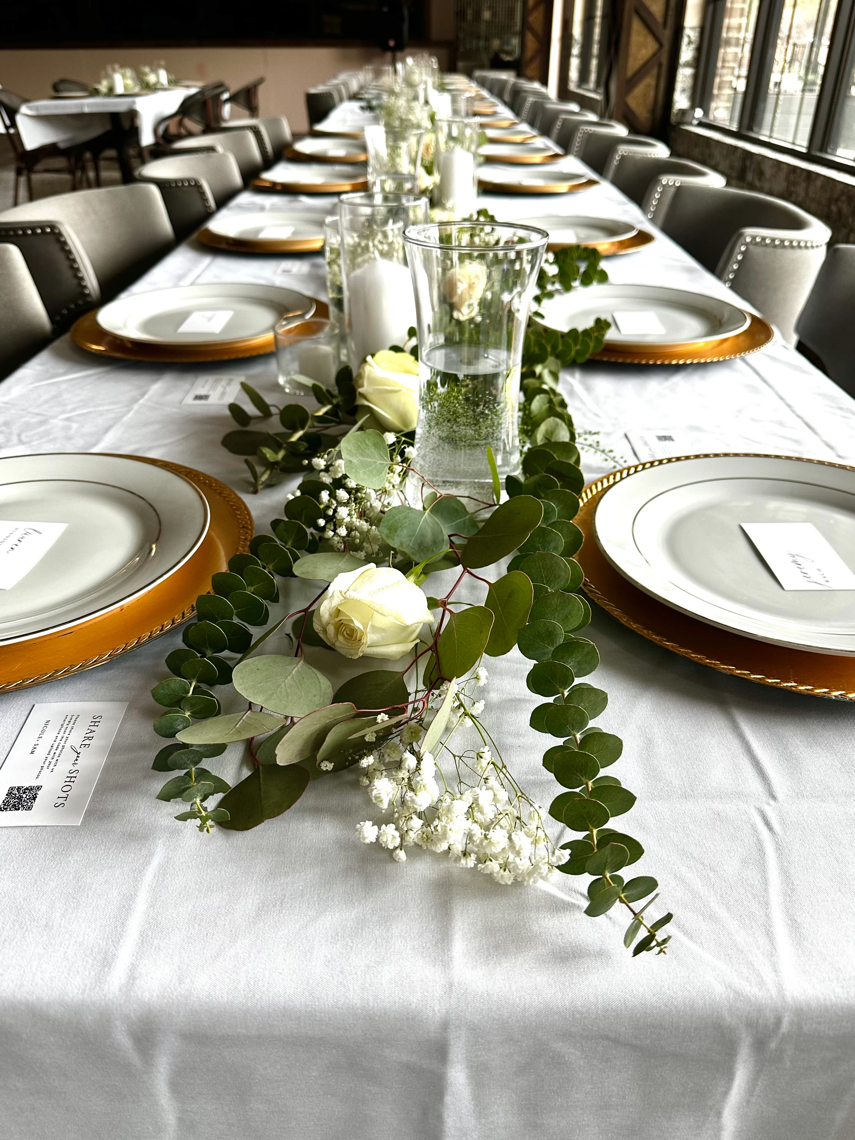 Elegant dining setup with floral decor and gold-accented plates