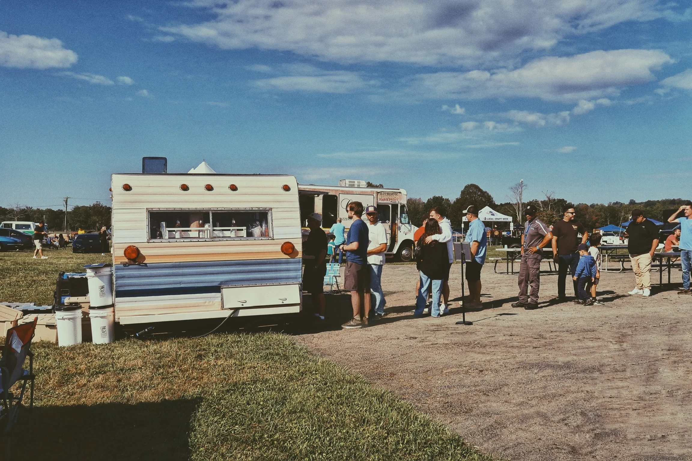 Food truck serving customers at an outdoor event