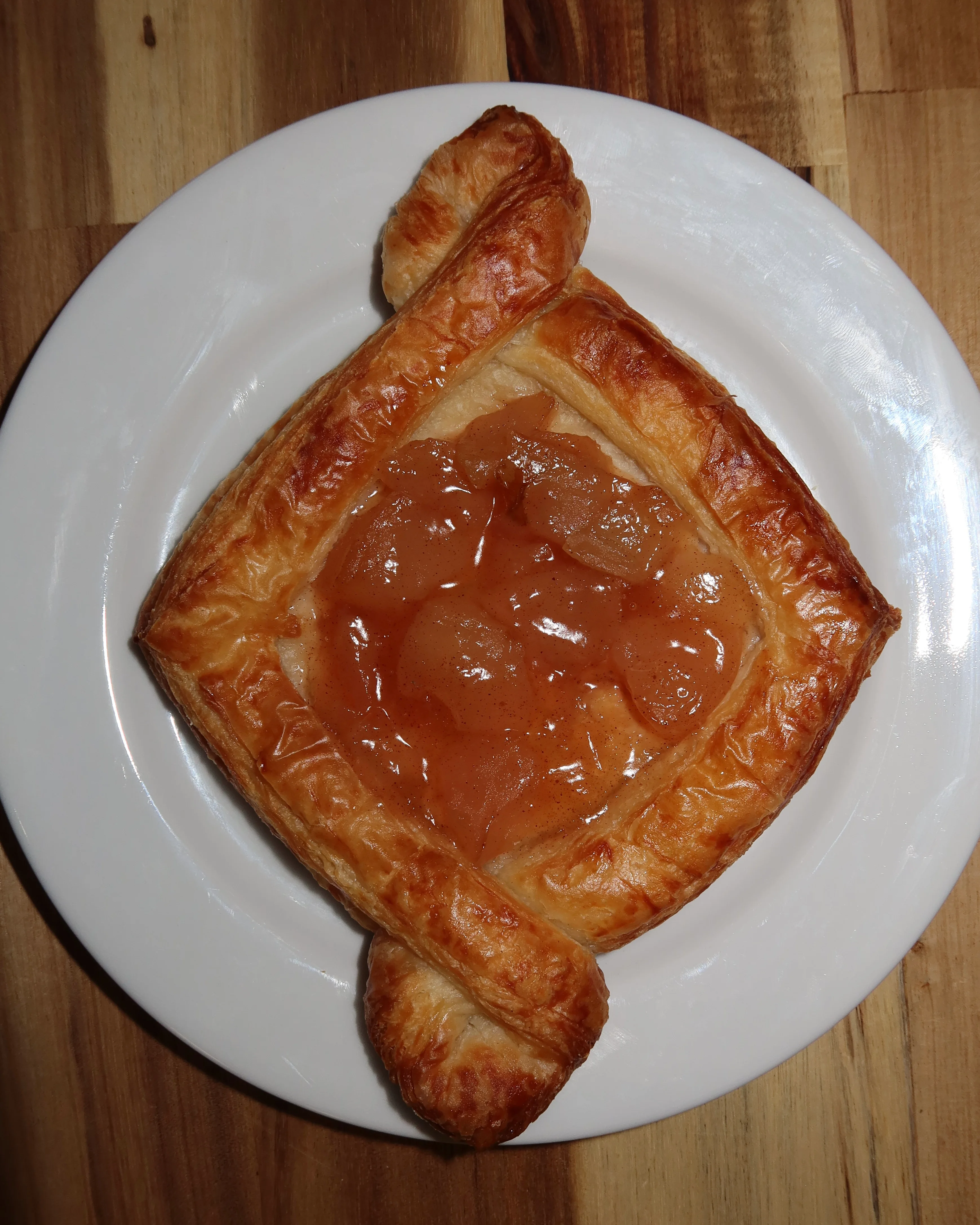 Delicious apple danish pastry on a white plate