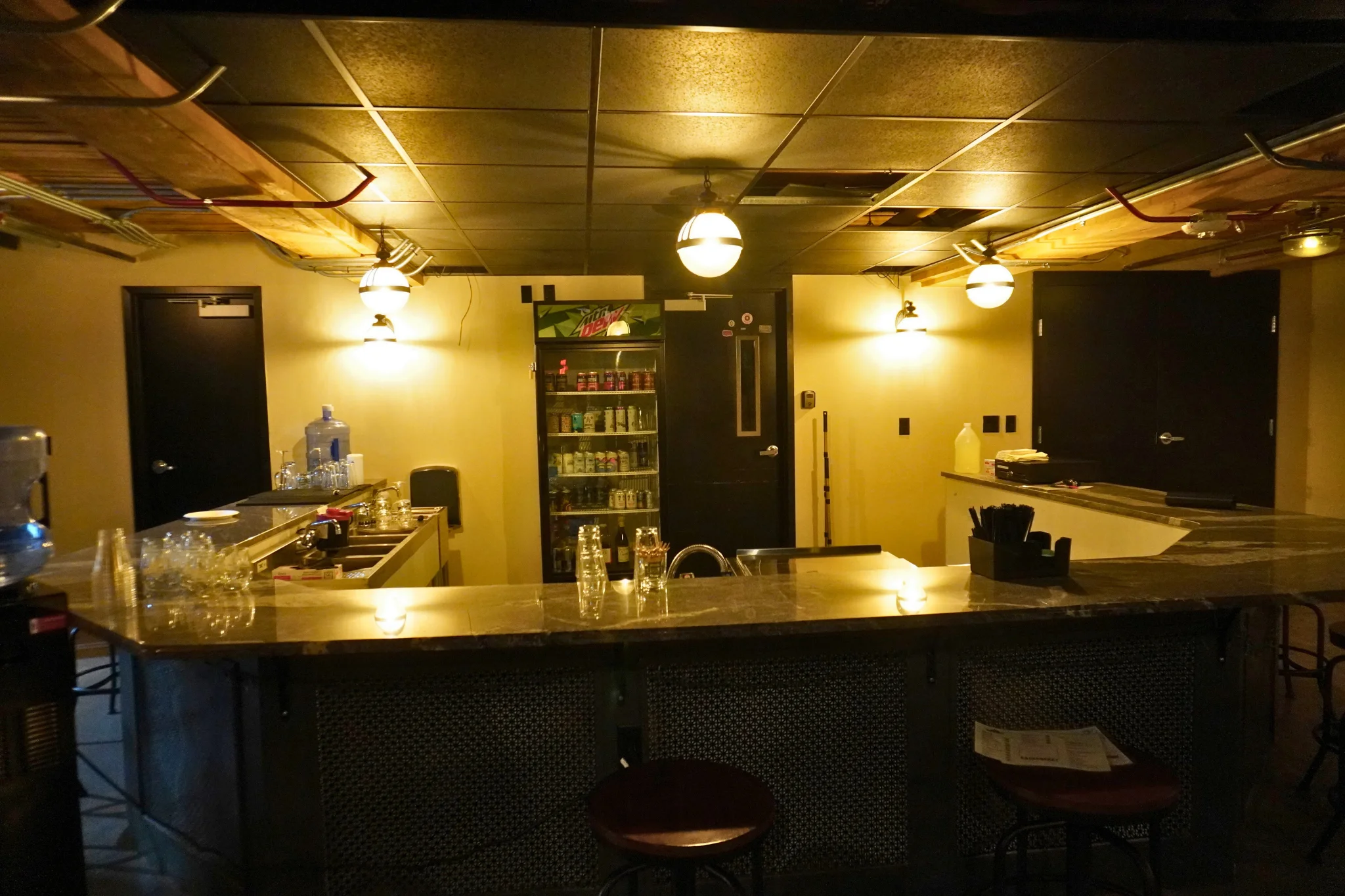 Modern bar counter with stylish lighting and seating