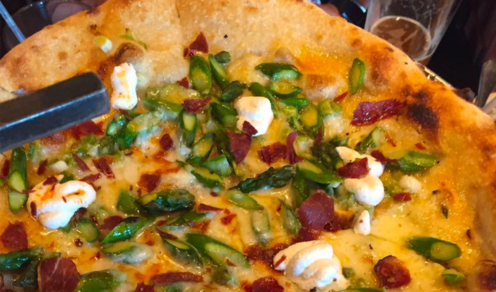 close up of a pizza with fresh cheese