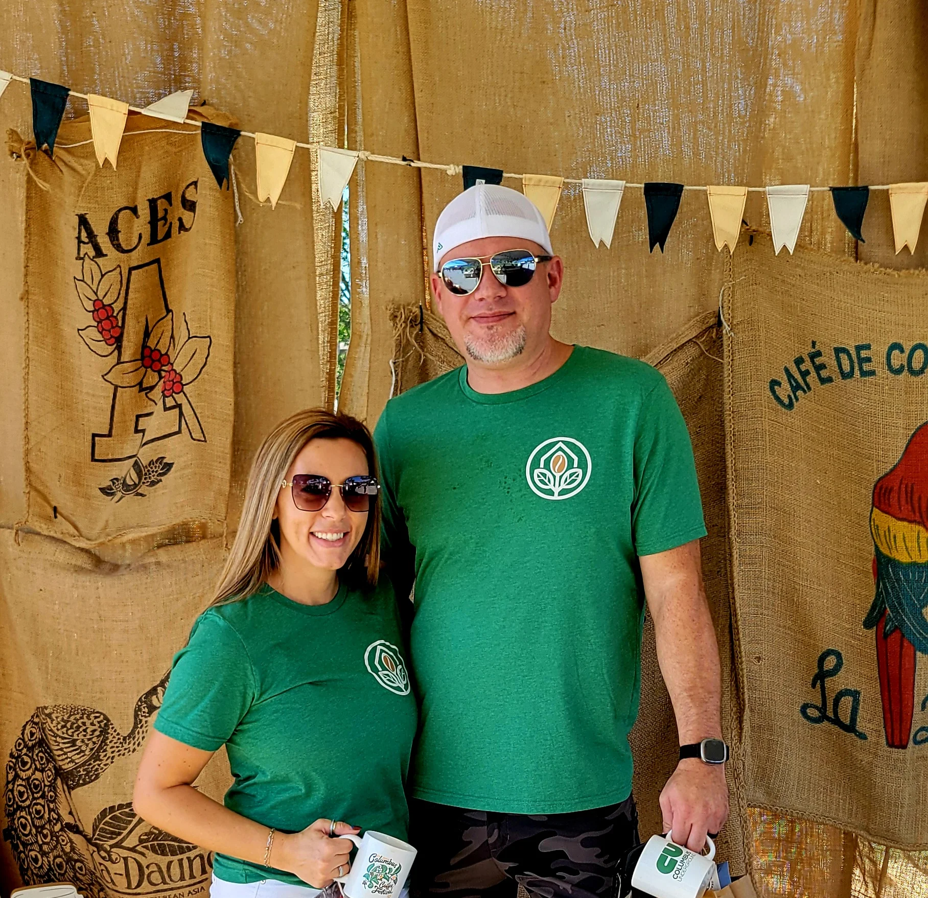 Couple at a food festival booth with coffee and snacks
