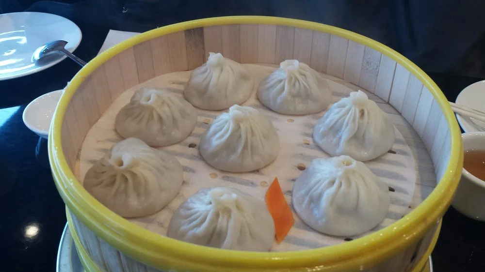 Steaming basket of Chinese xiao long bao dumplings