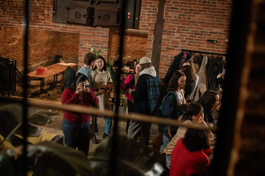 Social gathering in a cozy restaurant with exposed brick walls