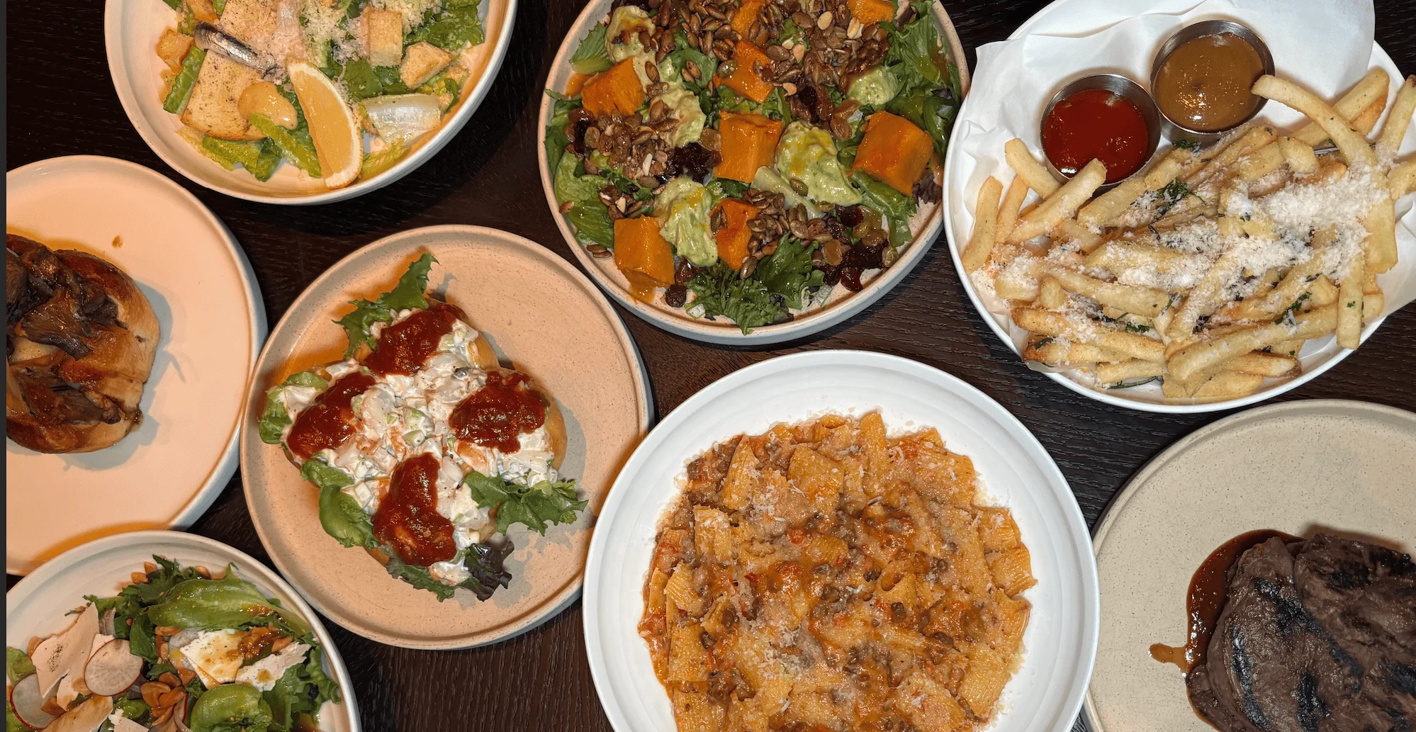 Assorted Italian dishes including pasta and salads