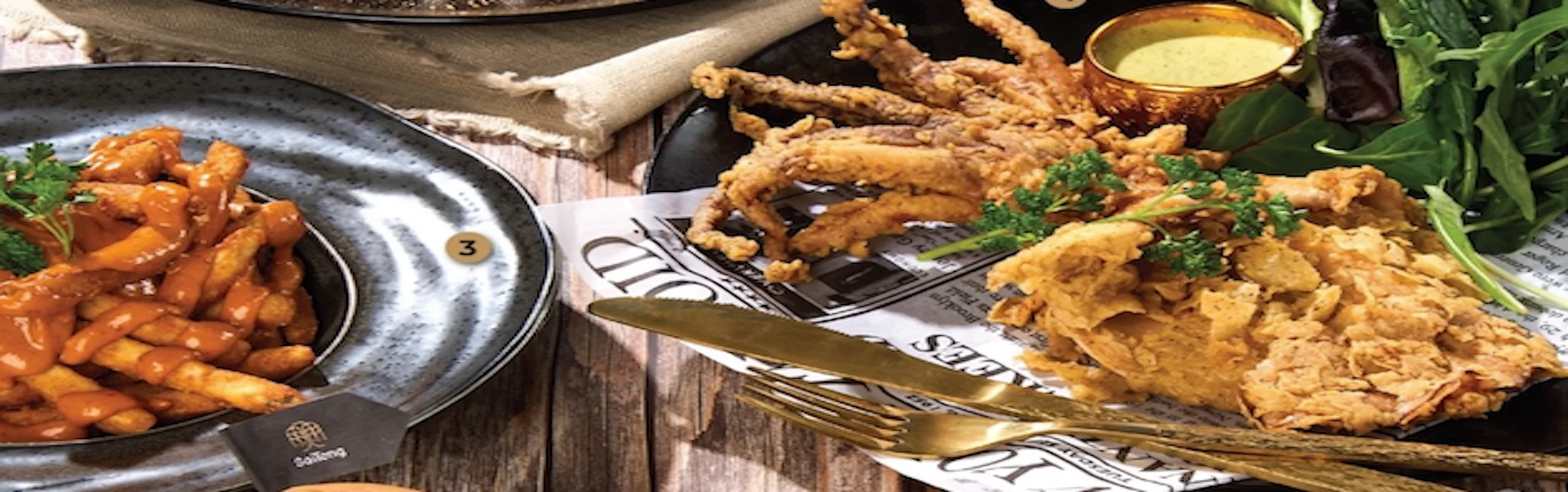 Crispy fried chicken and fries with spicy sauce