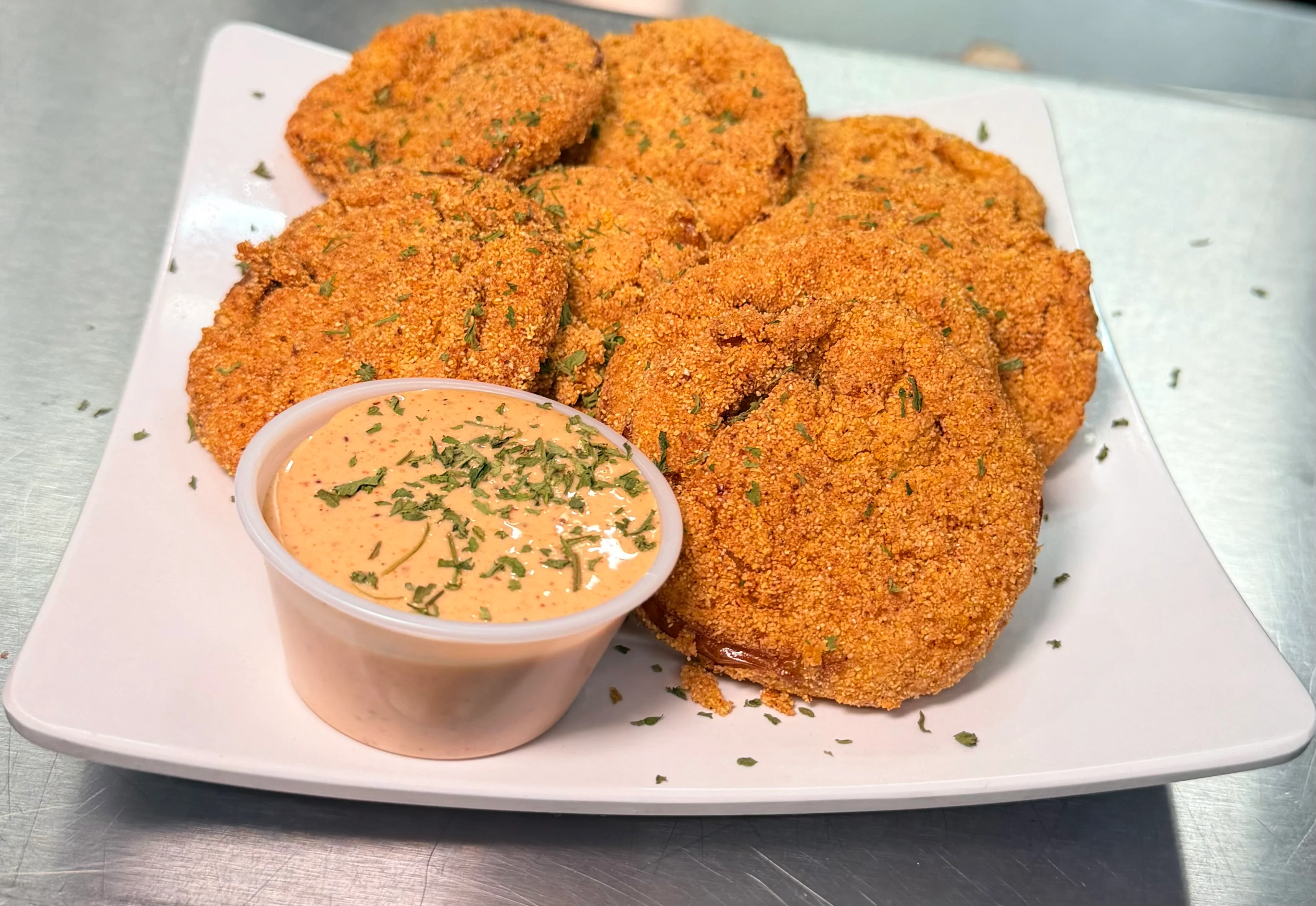 Crispy Southern-style fried green tomatoes with dipping sauce