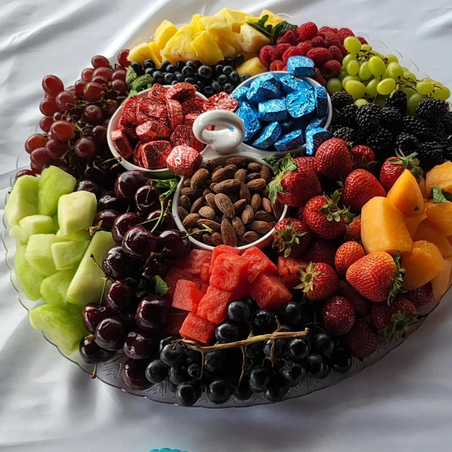 Colorful fruit platter with assorted fresh fruits and nuts