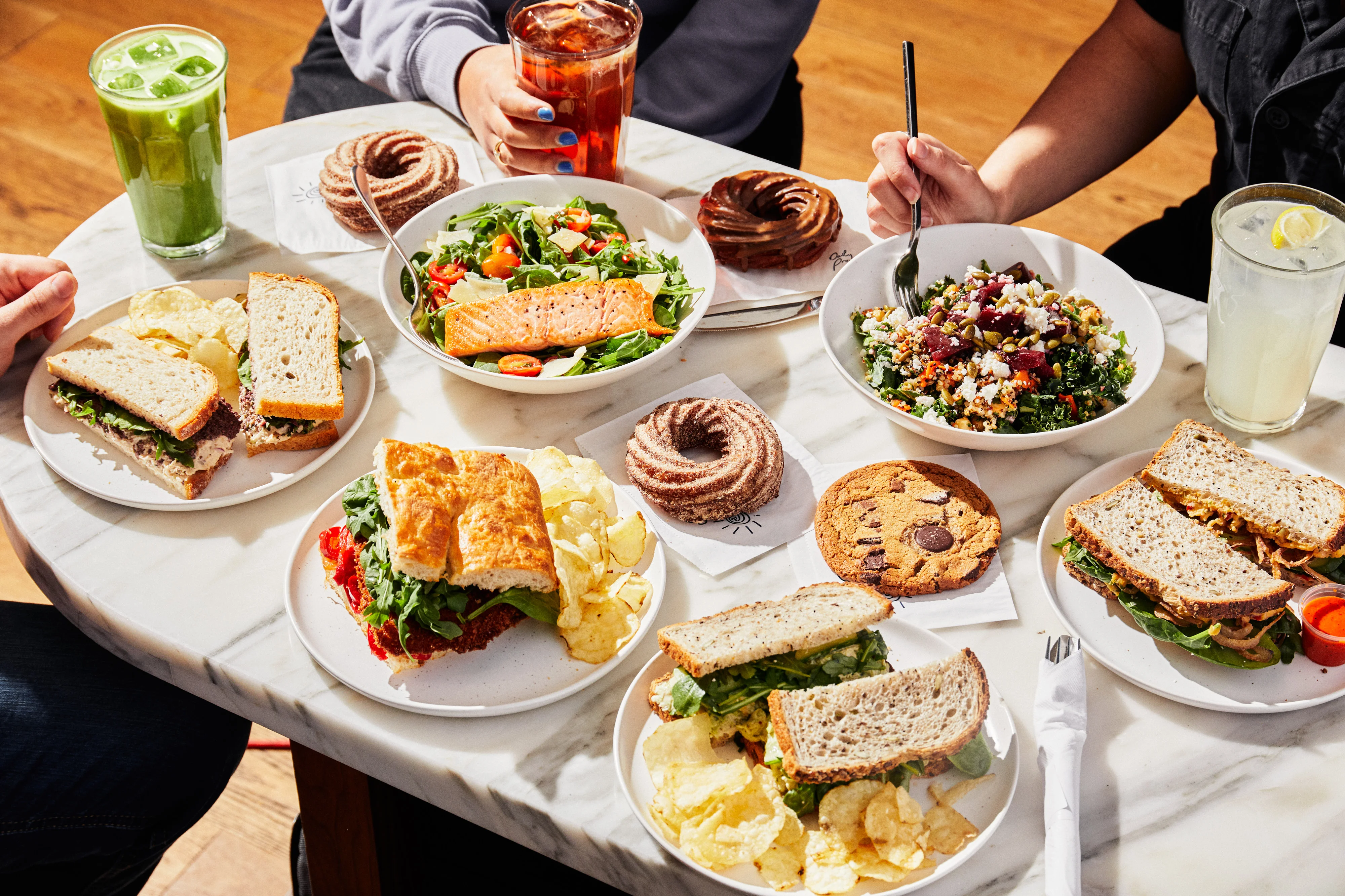 Assorted sandwiches and salads on a dining table