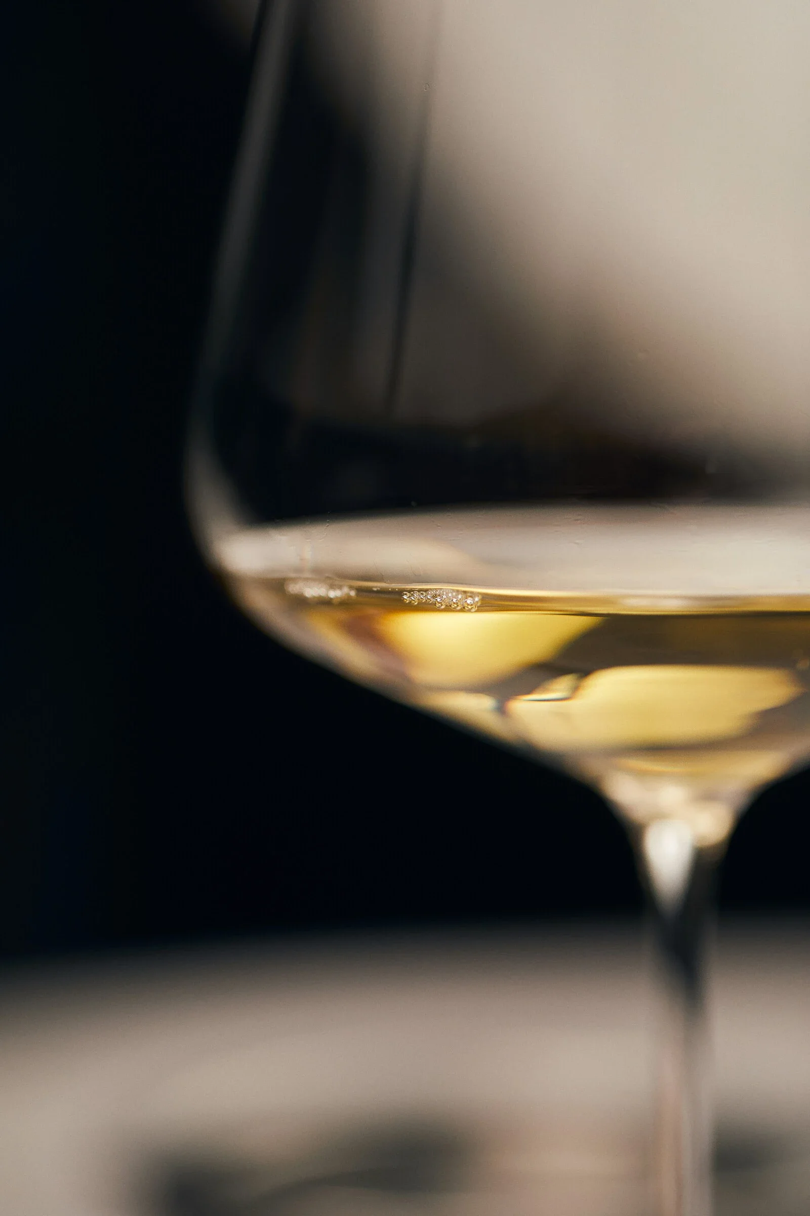 Elegant glass of white wine with golden hues