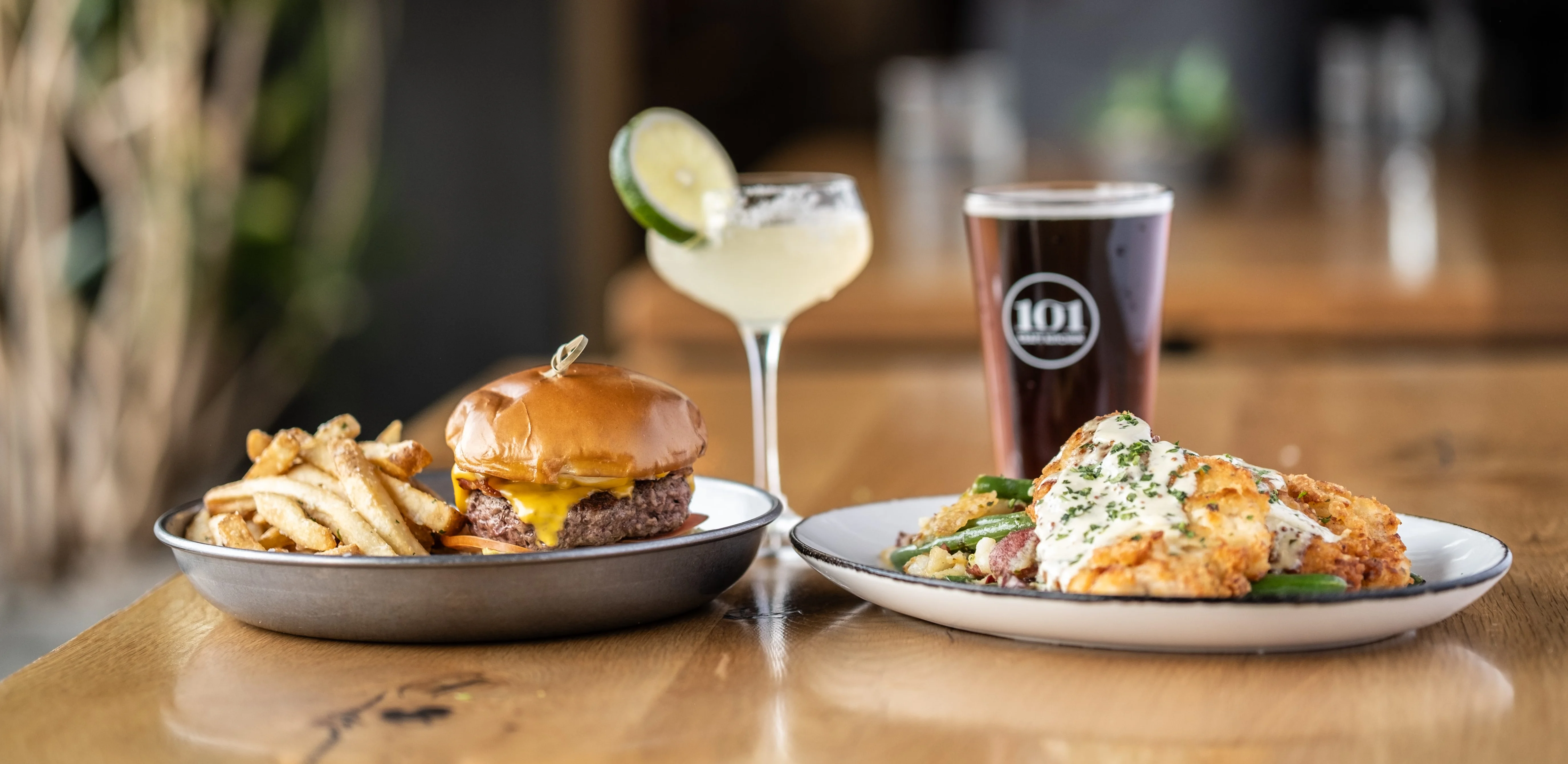 Classic American cheeseburger with fries and craft beer