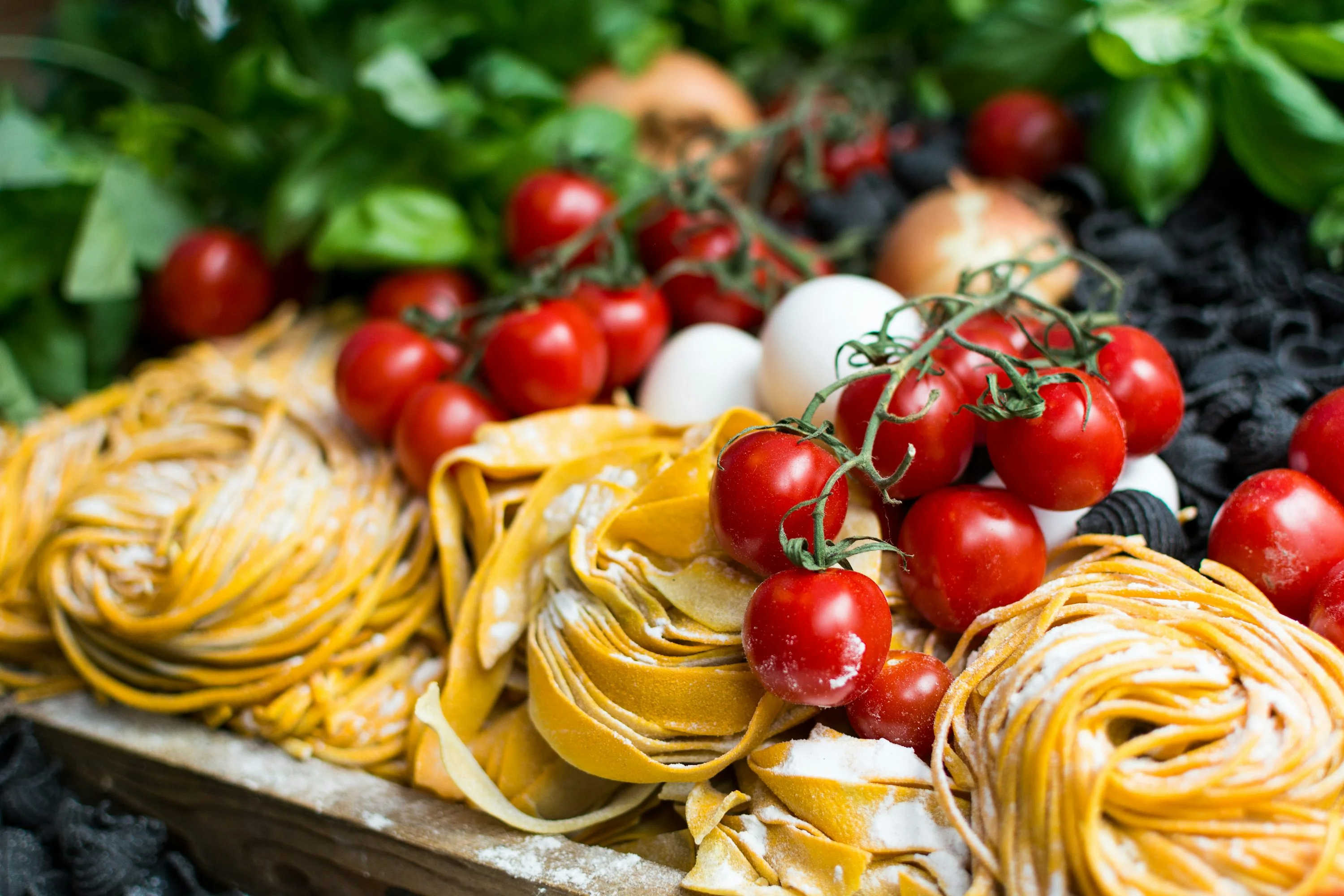 Fresh Italian pasta with cherry tomatoes and basil