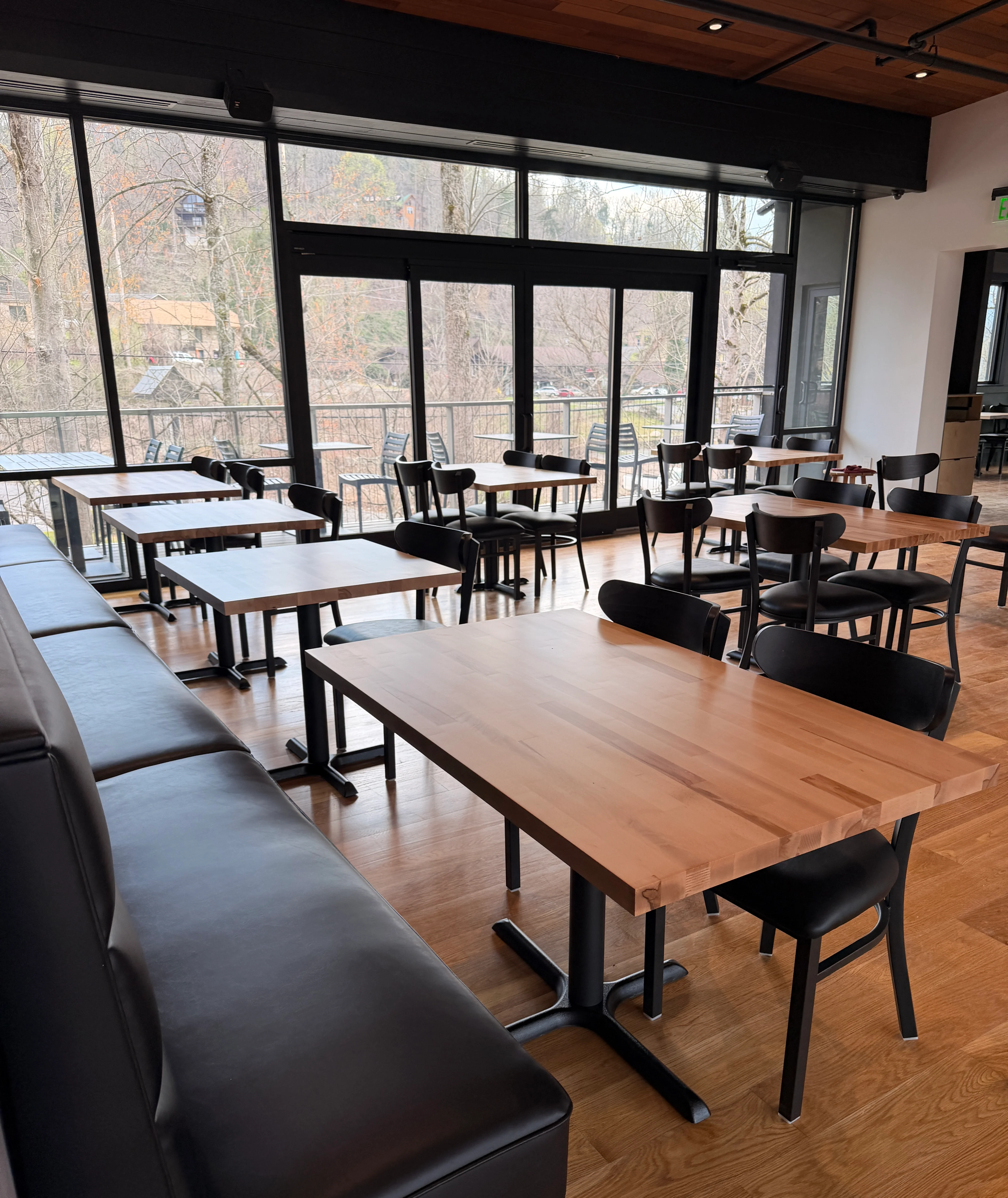Delicious gourmet burger with fresh toppings on a wooden table
