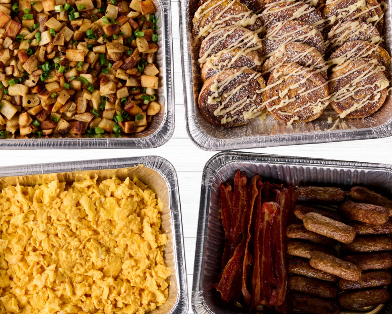 A beautifully arranged catering spread with various dishes and garnishes.