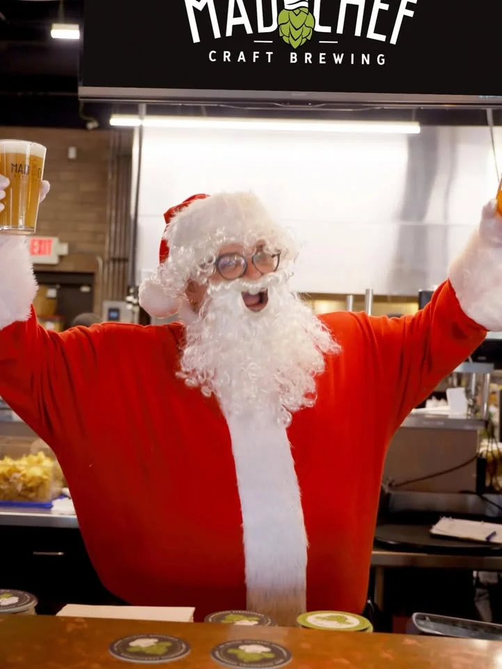 Santa-themed bartender celebrating at a craft brewery