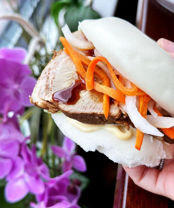 Vietnamese bánh bao with pork and pickled vegetables