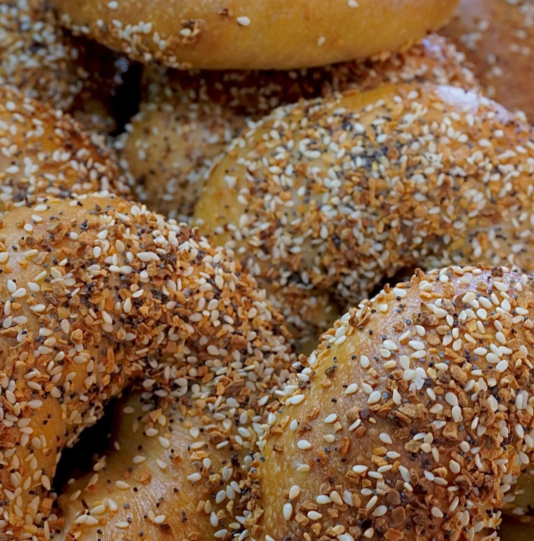 Freshly baked everything bagels with sesame and poppy seeds