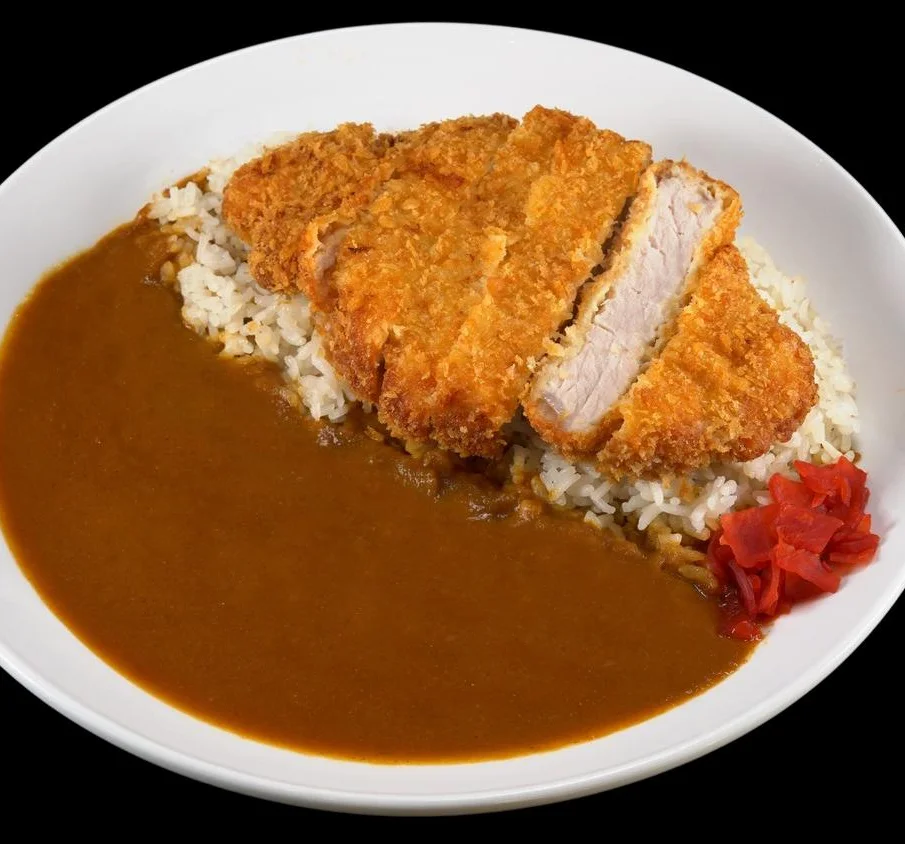 Japanese katsu curry served with rice and pickled ginger
