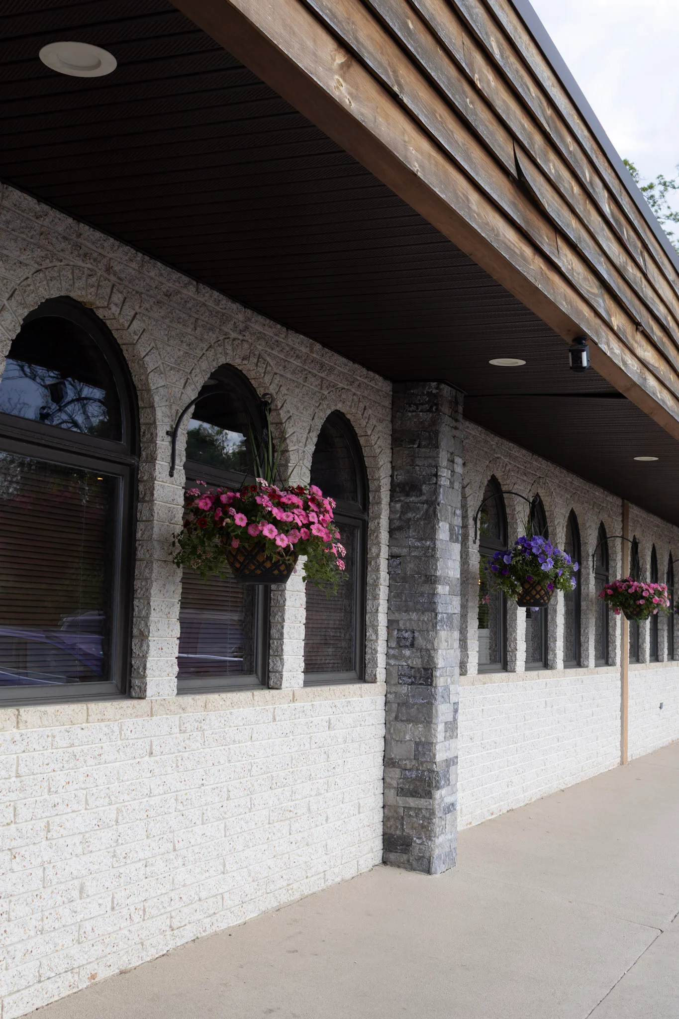 Charming restaurant exterior with flower baskets