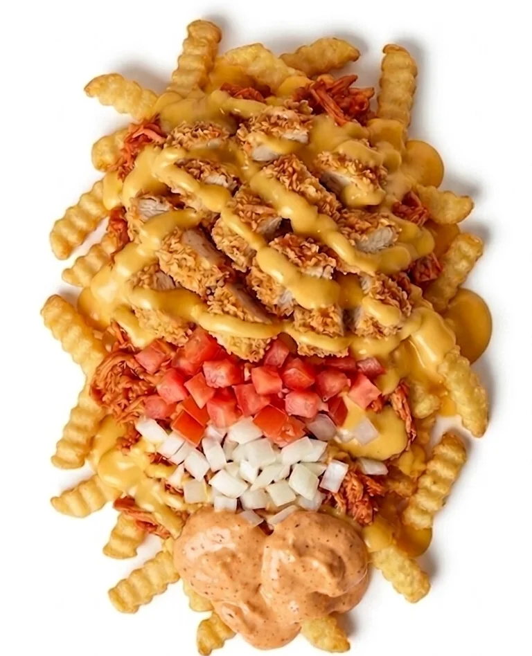 Crispy chicken nuggets served with a side of dipping sauce