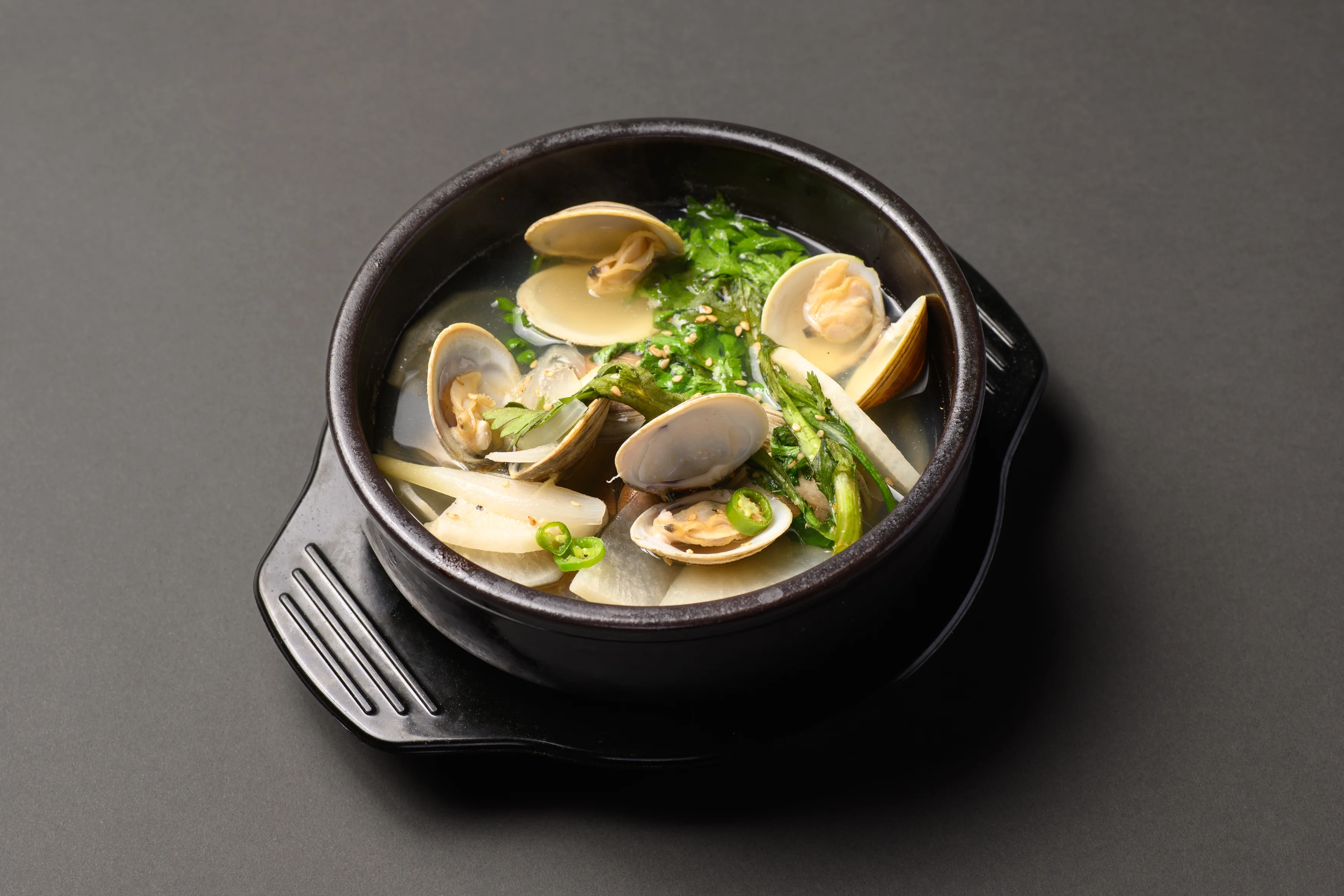 Korean clam soup in a traditional stone pot