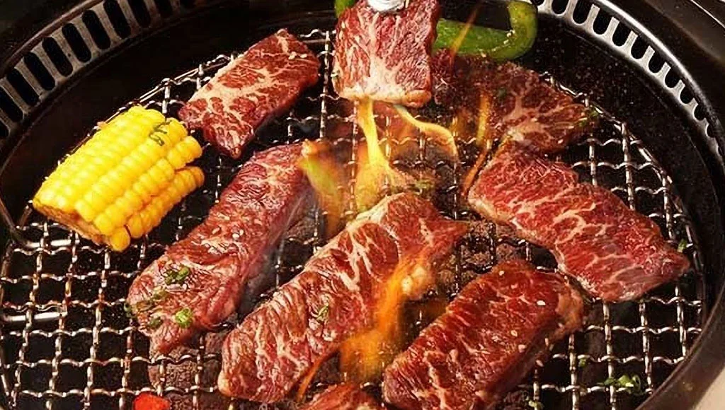 Korean barbecue with marinated beef on a grill