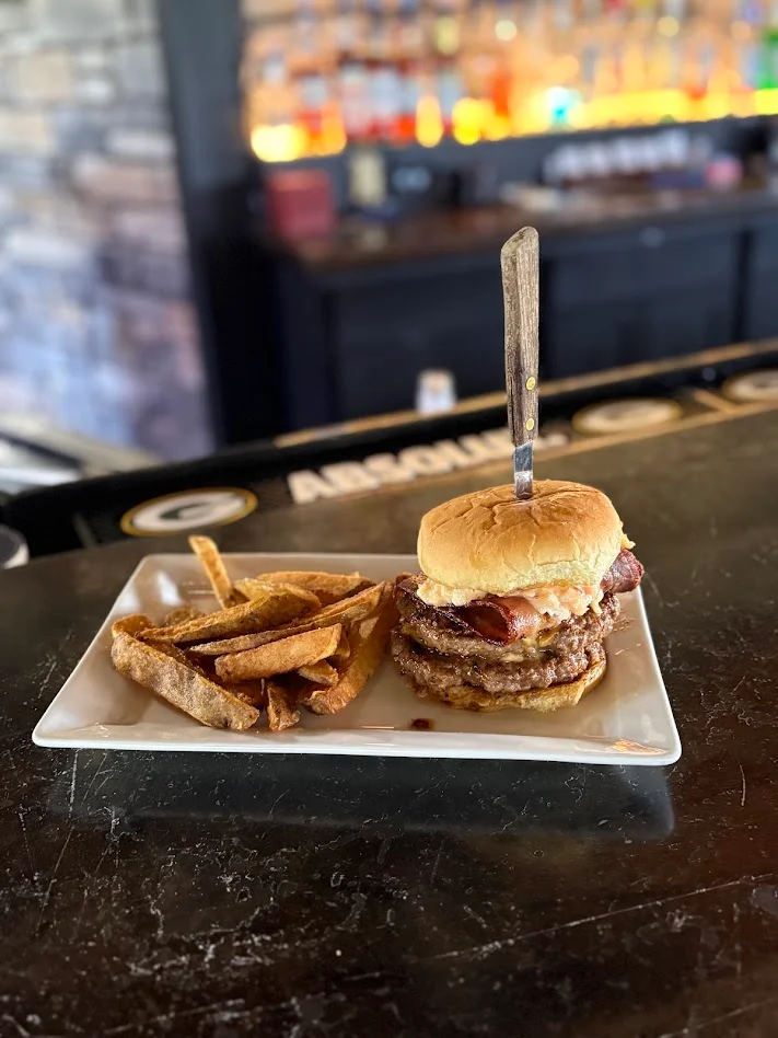 Double Bacon Cheese Burger with sweet chili coleslaw on a brioche bun 