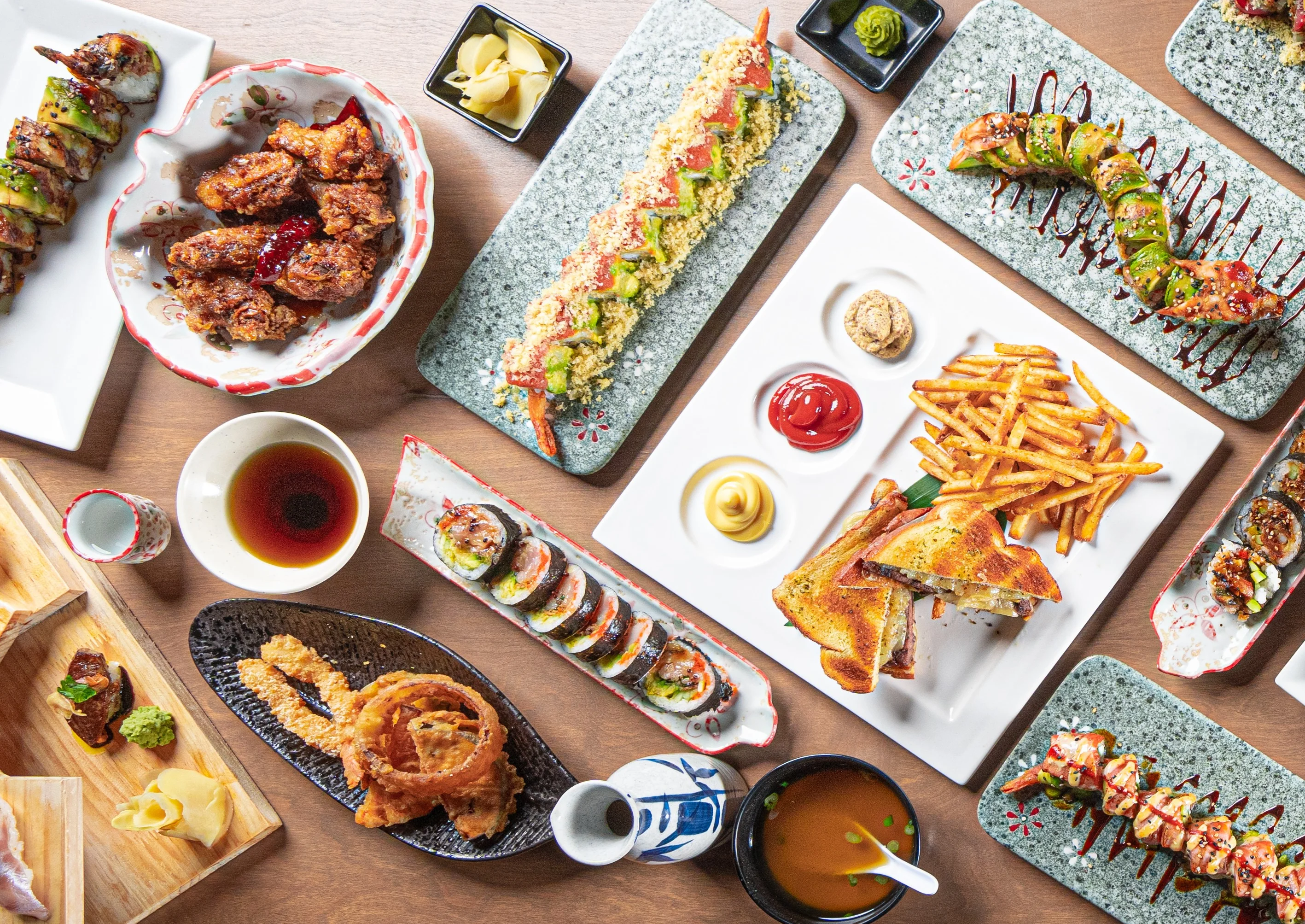 Assorted Japanese sushi and rolls served on elegant plates at Ginza Japanese Restaurant located at 5868 San Felipe Street, Houston, TX 77057