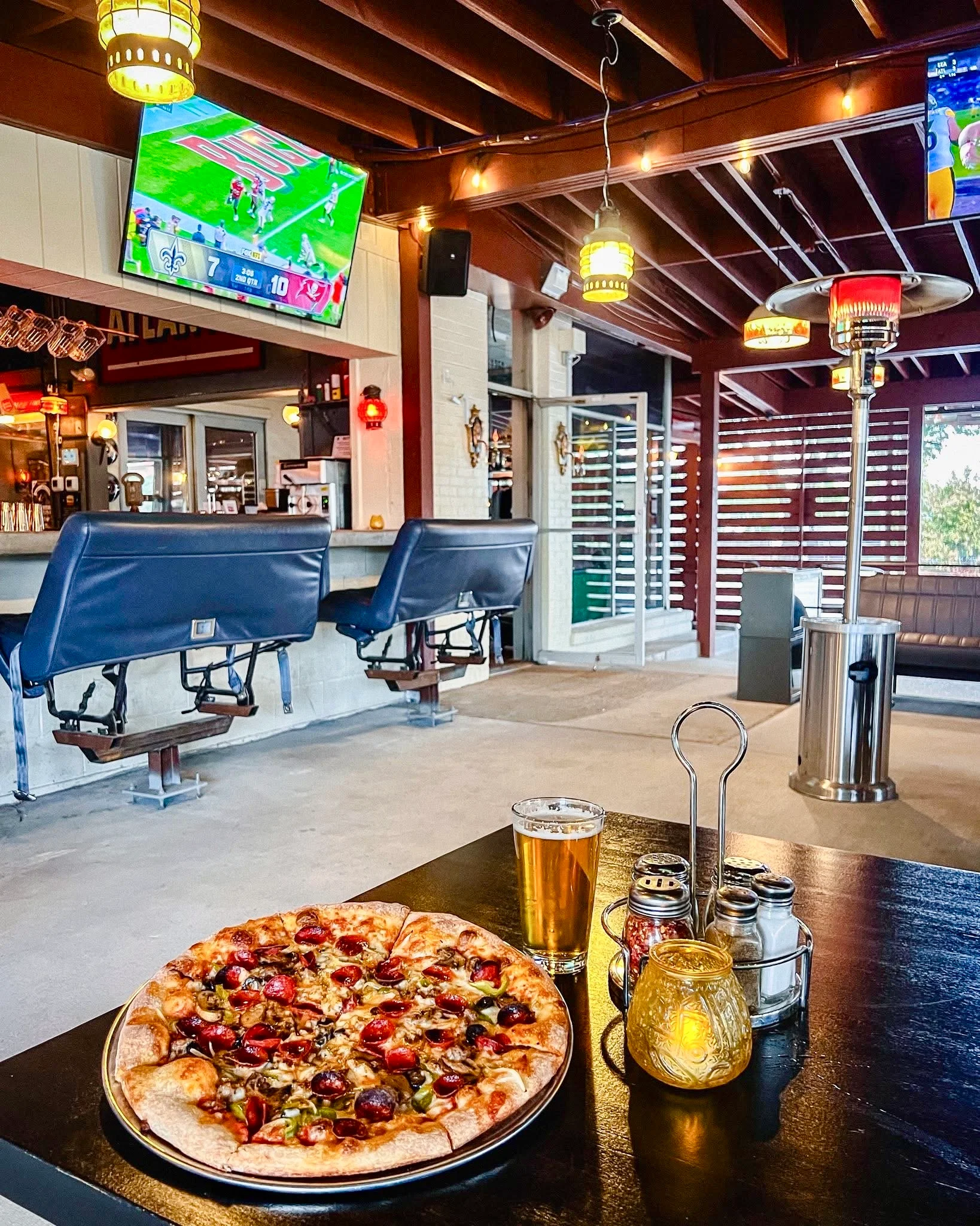 Delicious gourmet burger with fresh toppings on a wooden table