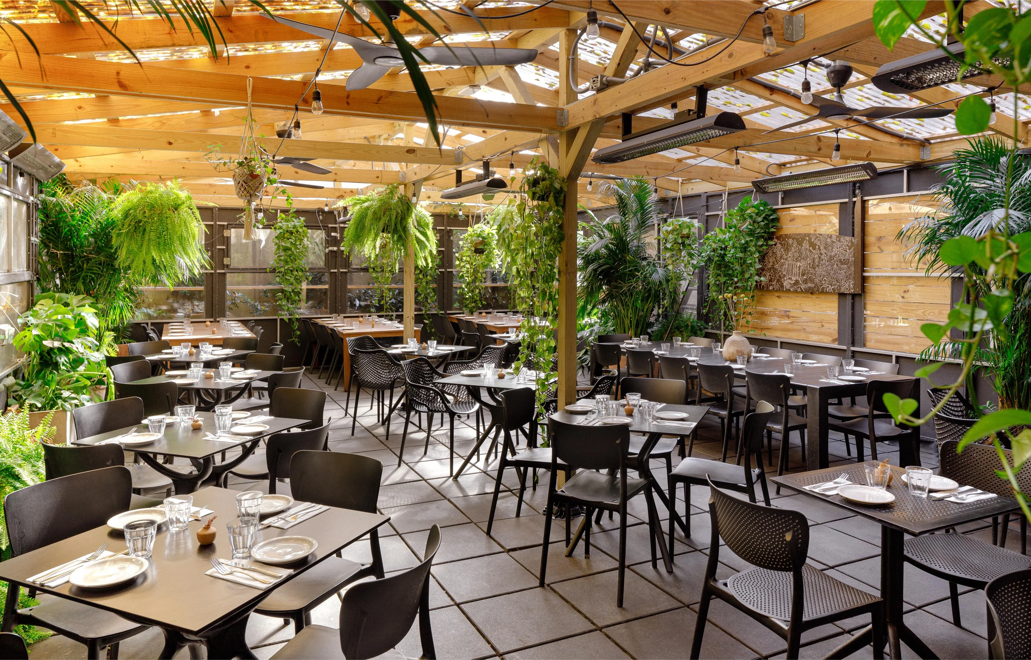 Stylish restaurant interior with greenery and modern decor